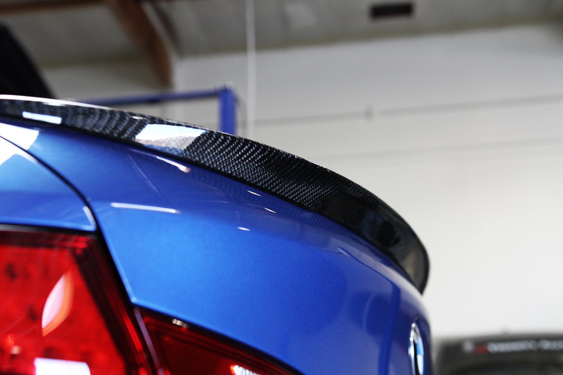 Carbon Fiber Lip Spoiler on Blue BMW 5-Series - Photo by Vorstiner
