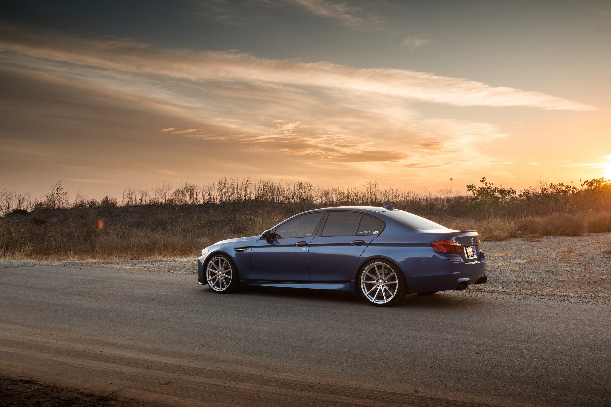 Chrome Vossen Wheels on Blue BMW 5-Series - Photo by TSW