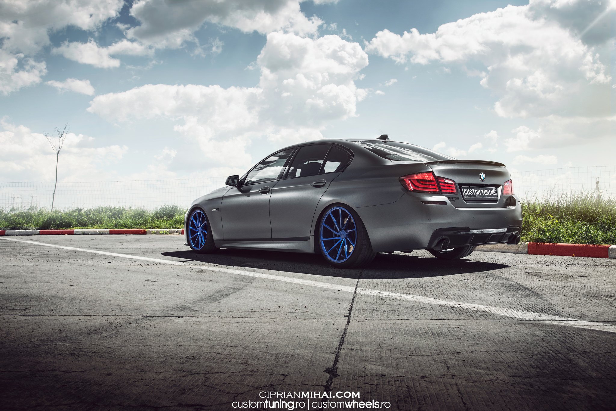 Gray BMW 5-Series with Carbon Fiber Rear Lip Spoiler - Photo by Ciprian Mihai