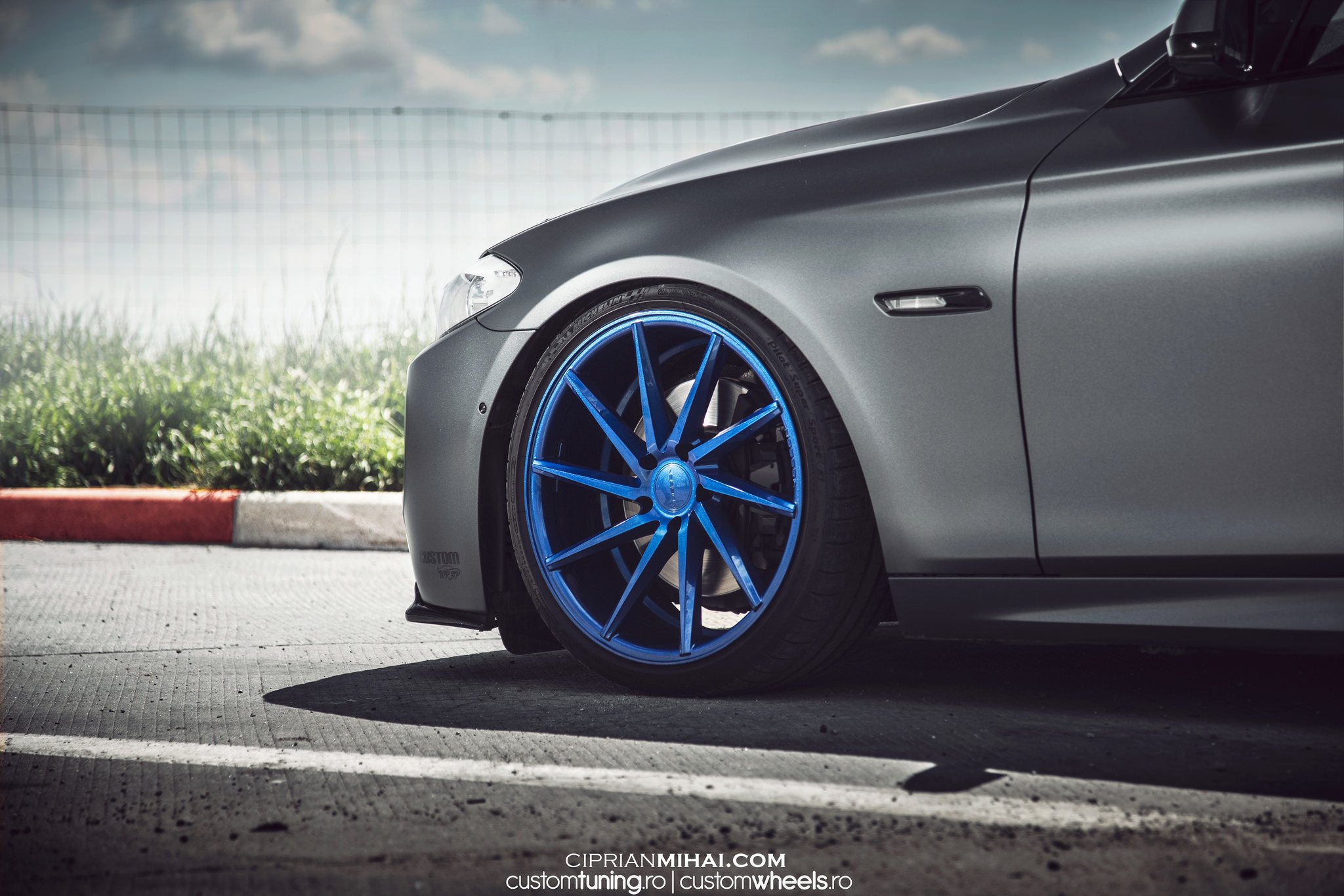Gray BMW 5-Series on Michelin Tires - Photo by Ciprian Mihai