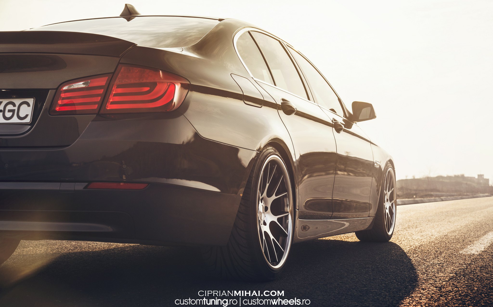 Black BMW 5-Series with Red LED Taillights  - Photo by Ciprian Mihai