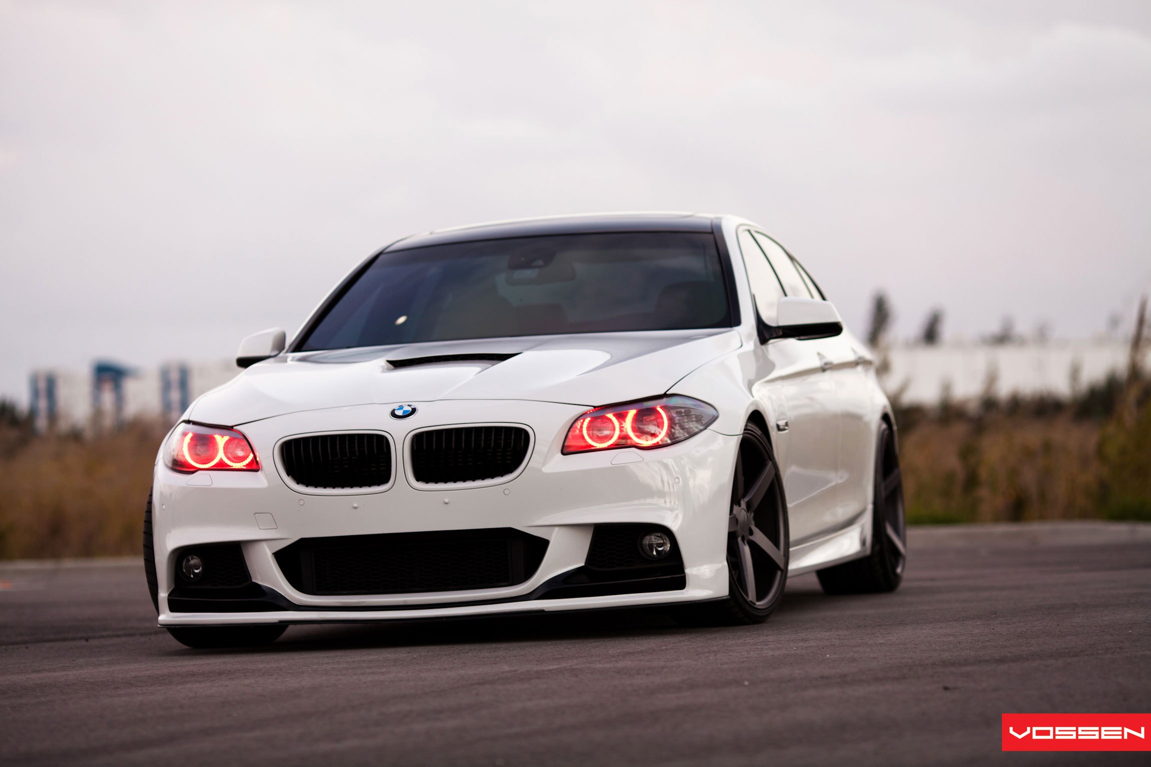 Custom Front Bumper with Fog Lights on White BMW 5-Series - Photo by Vossen