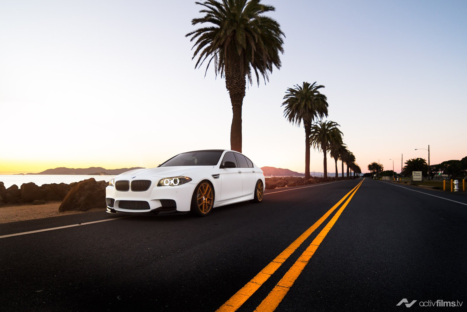 White BMW 5-Series with Custom Halo Headlights - Photo by Avant Garde Wheels