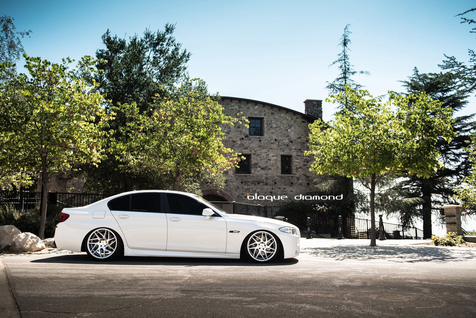 Custom White BMW 5-Series Side Skirts - Photo by Blaque Diamond