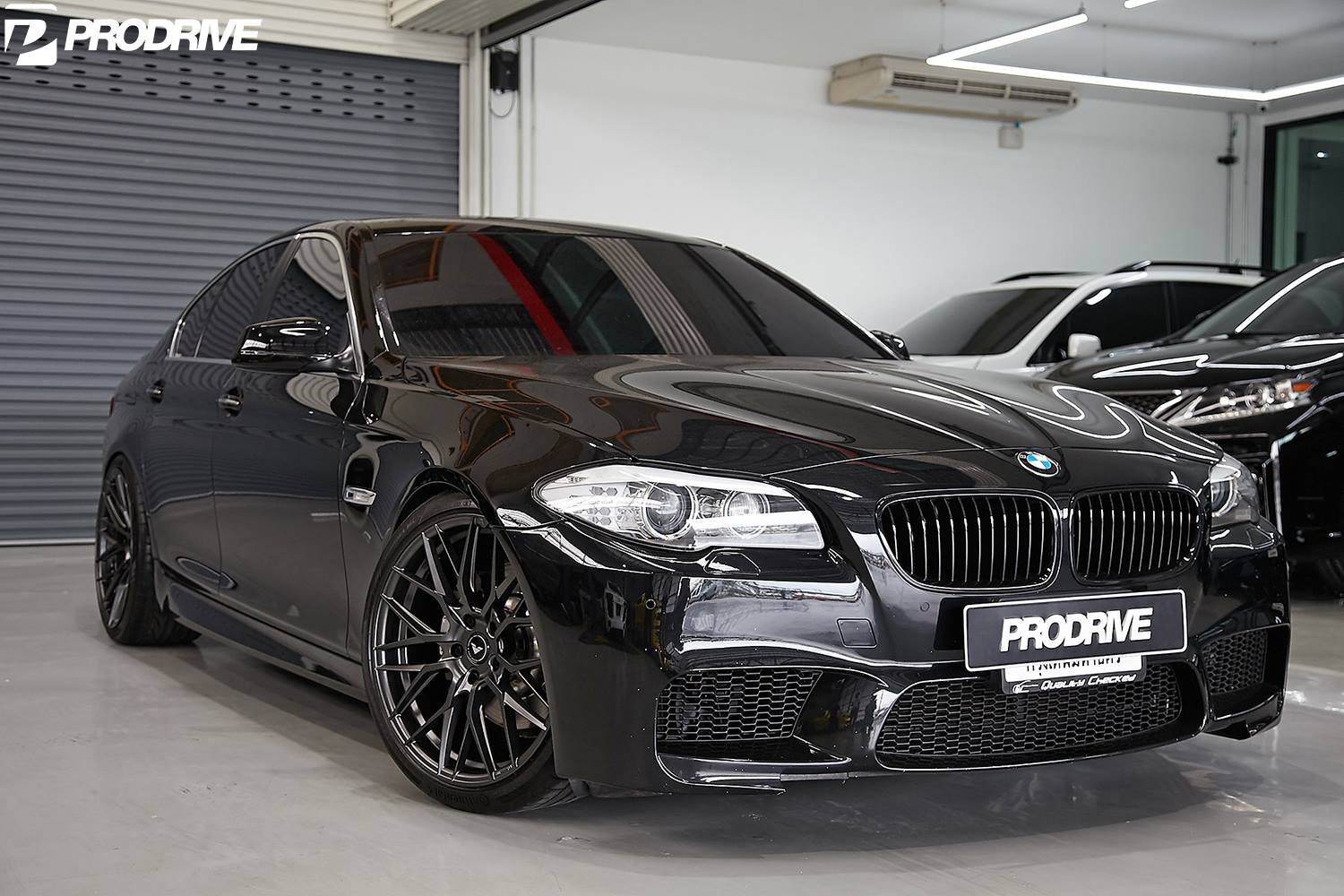 Black BMW 5-Series with Crystal Clear Headlights  - Photo by Vorstiner