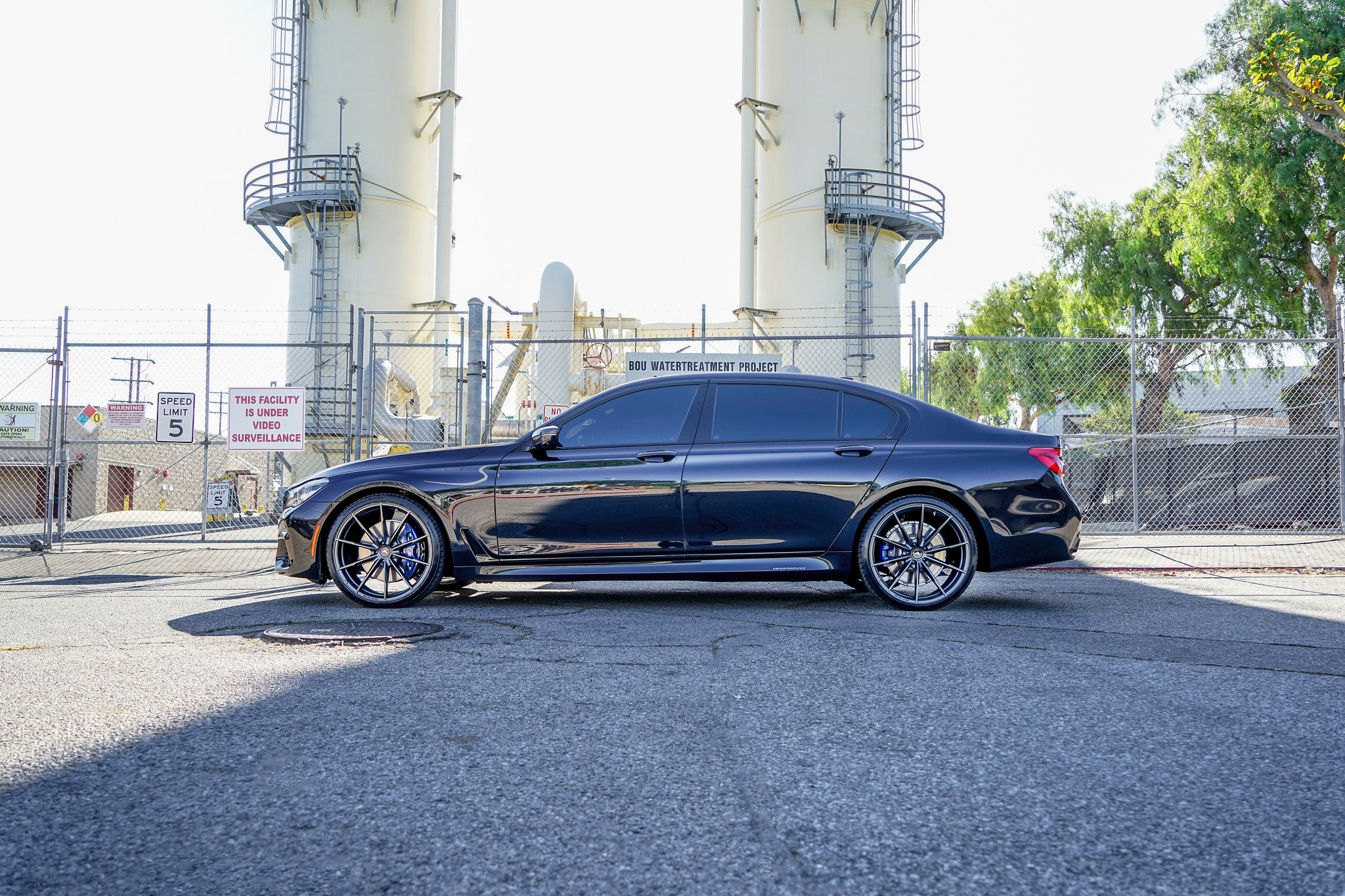 Aftermarket Side Skirts on Black BMW 7-Series - Photo by VIBE Motorsports