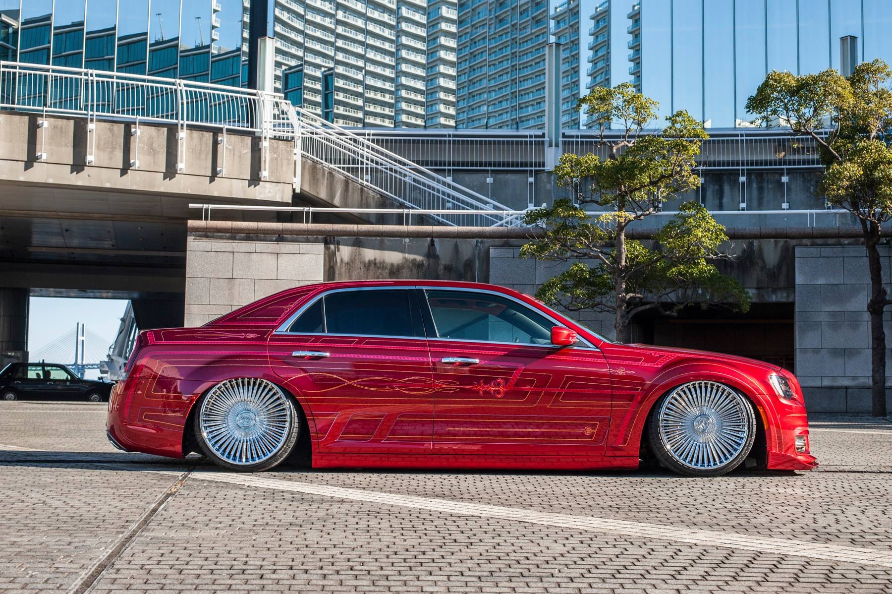 Aftermarket Side Skirts on Red Lowered Chrysler 300 - Photo by Lexani