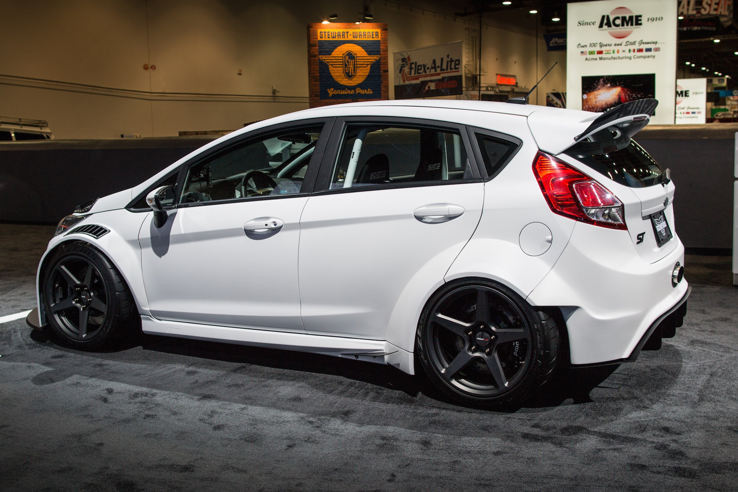 Large Roofline Spoiler with Light on White Ford Fiesta - Photo by Forgeline Motorsports
