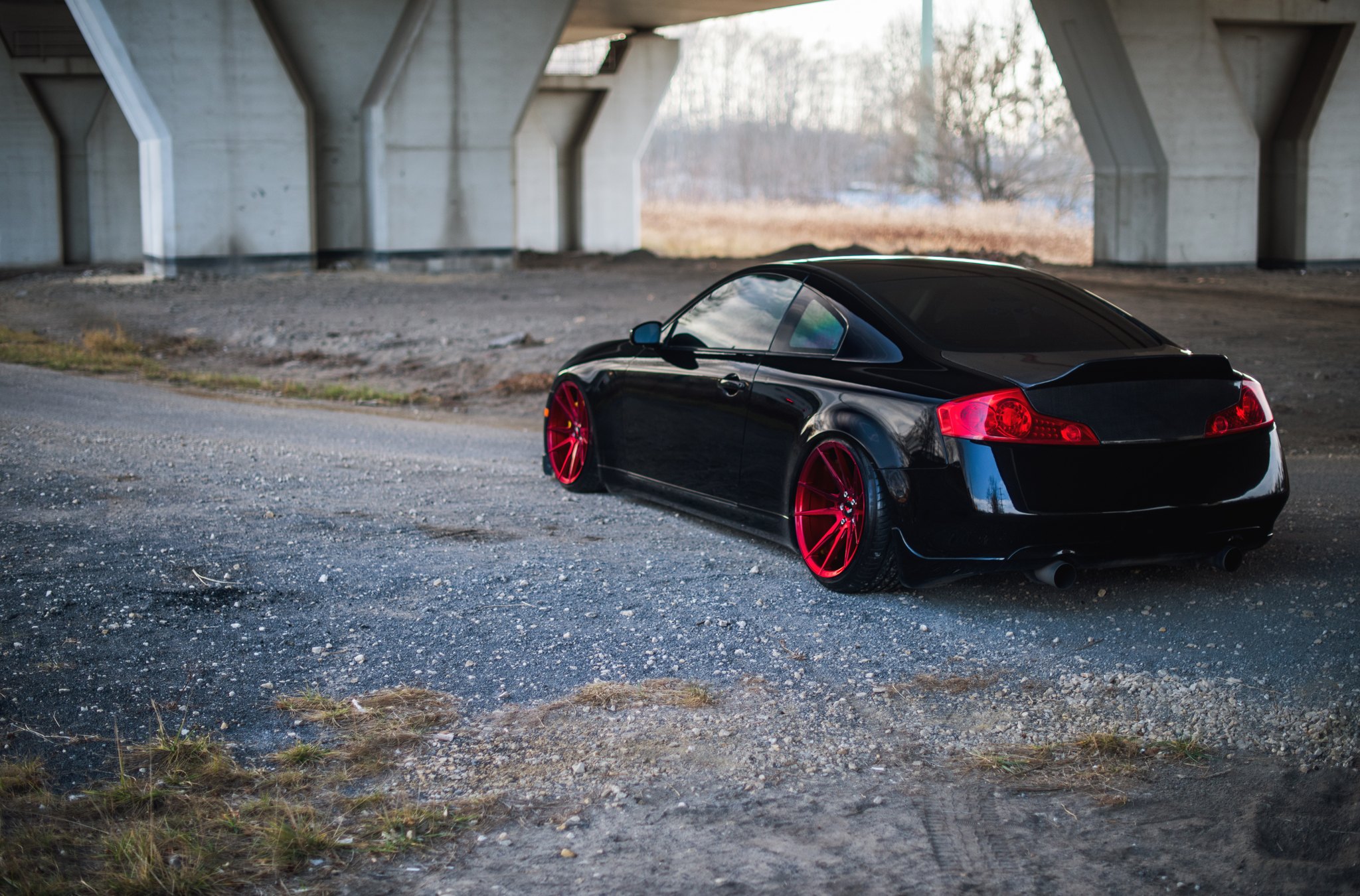Black Infiniti G35 with Custom Red JR Wheels - Photo by JR Wheels