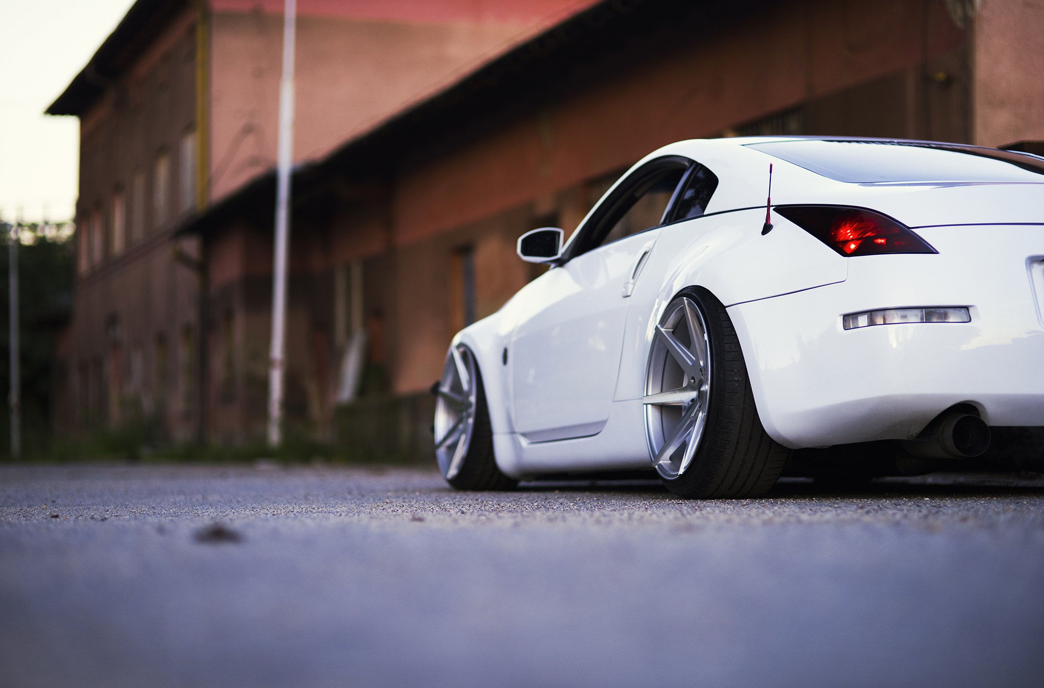 White Stanced Nissan 350Z with Aftermarket Rear Diffuser - Photo by JR Wheels