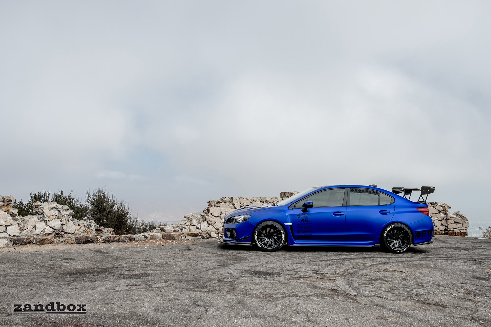Blue Subaru WRX with Custom Gloss Black Rims - Photo by zandbox