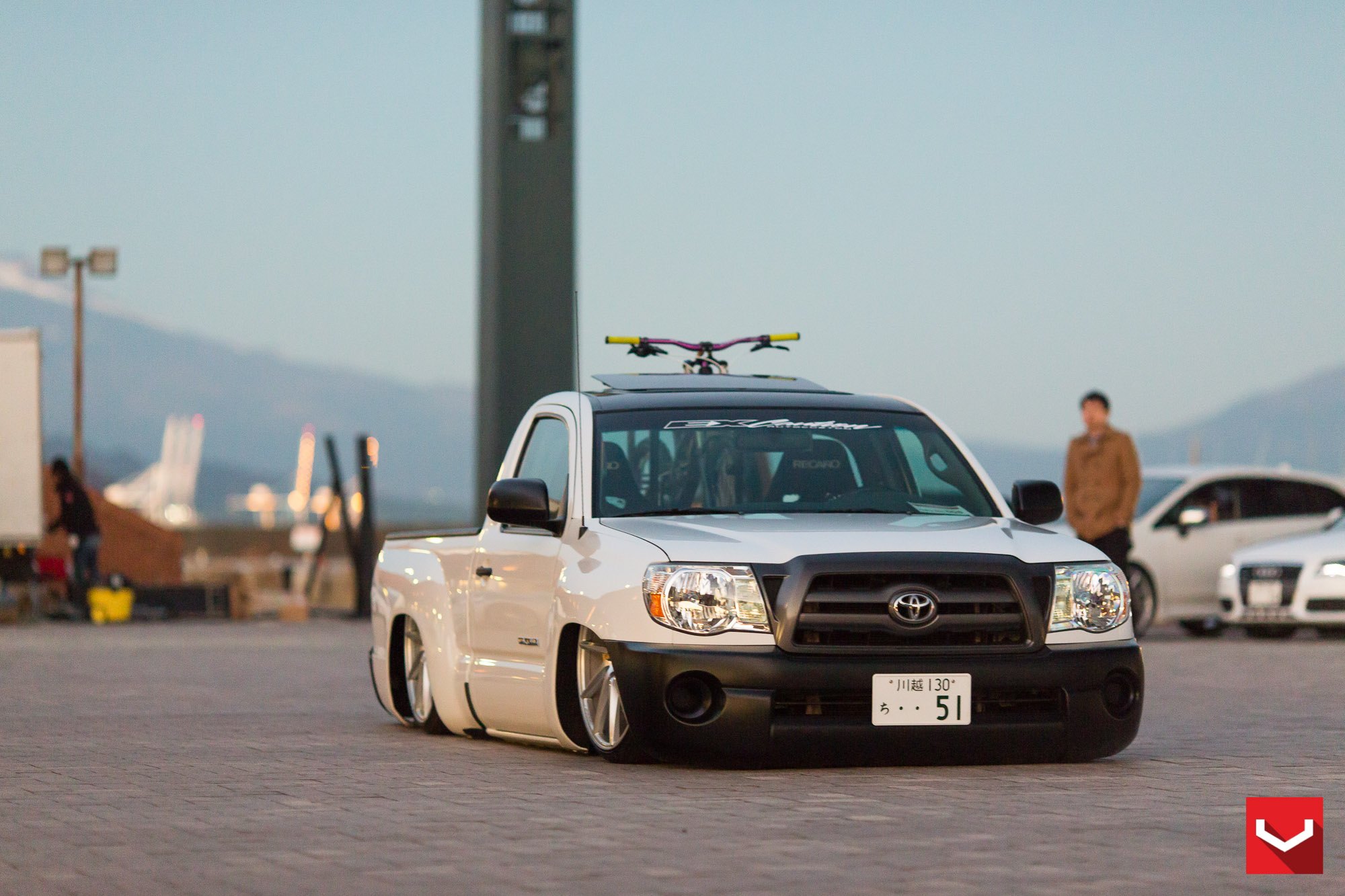 Custom Lowered Toyota Tacoma with Black Grille - Photo by Vossen