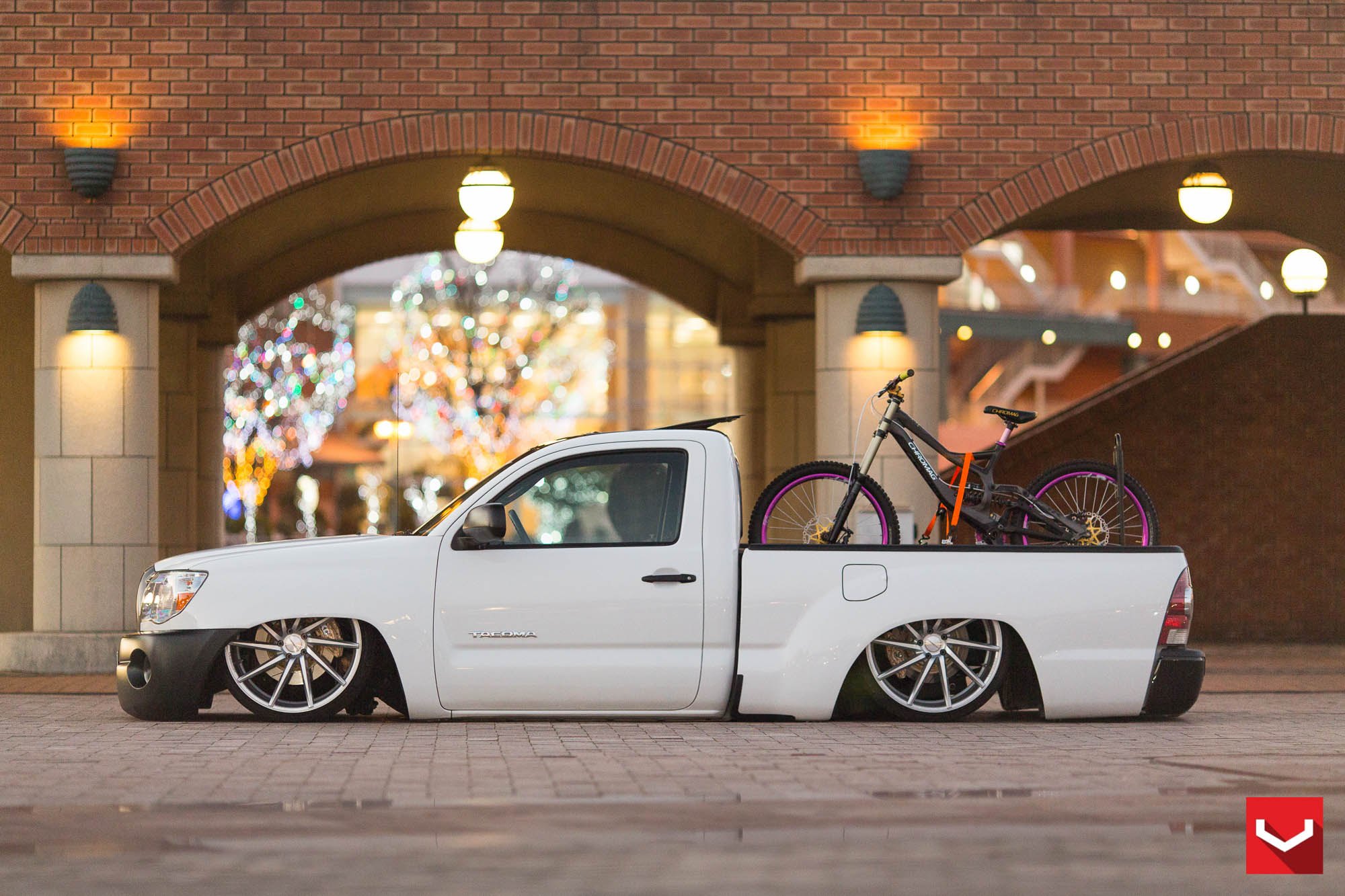 Lowered White Toyota Tacoma with Bike Rack  - Photo by Vossen