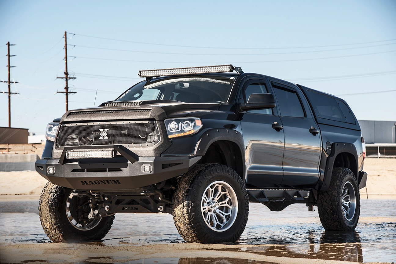 Lifted Toyota Tundra with a Camper Shell - Photo by Grid Off-road
