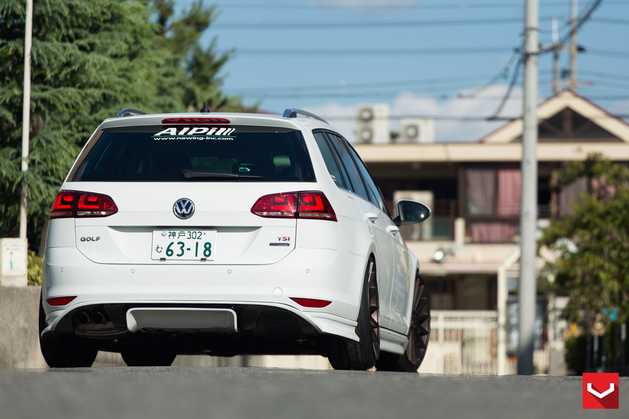 White VW Golf with Custom Rear Bumper Cover - Photo by Vossen