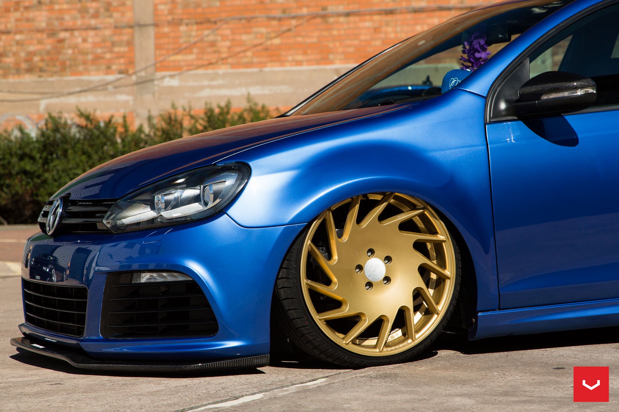 Blue Stanced VW Golf with Aftermarket Headlights - Photo by Vossen