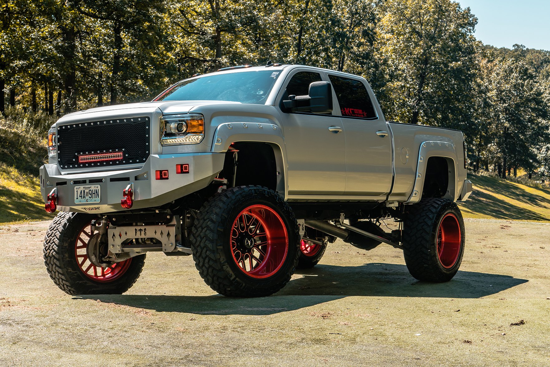Lifted GMC sierra by KC Customs - Photo by American Force