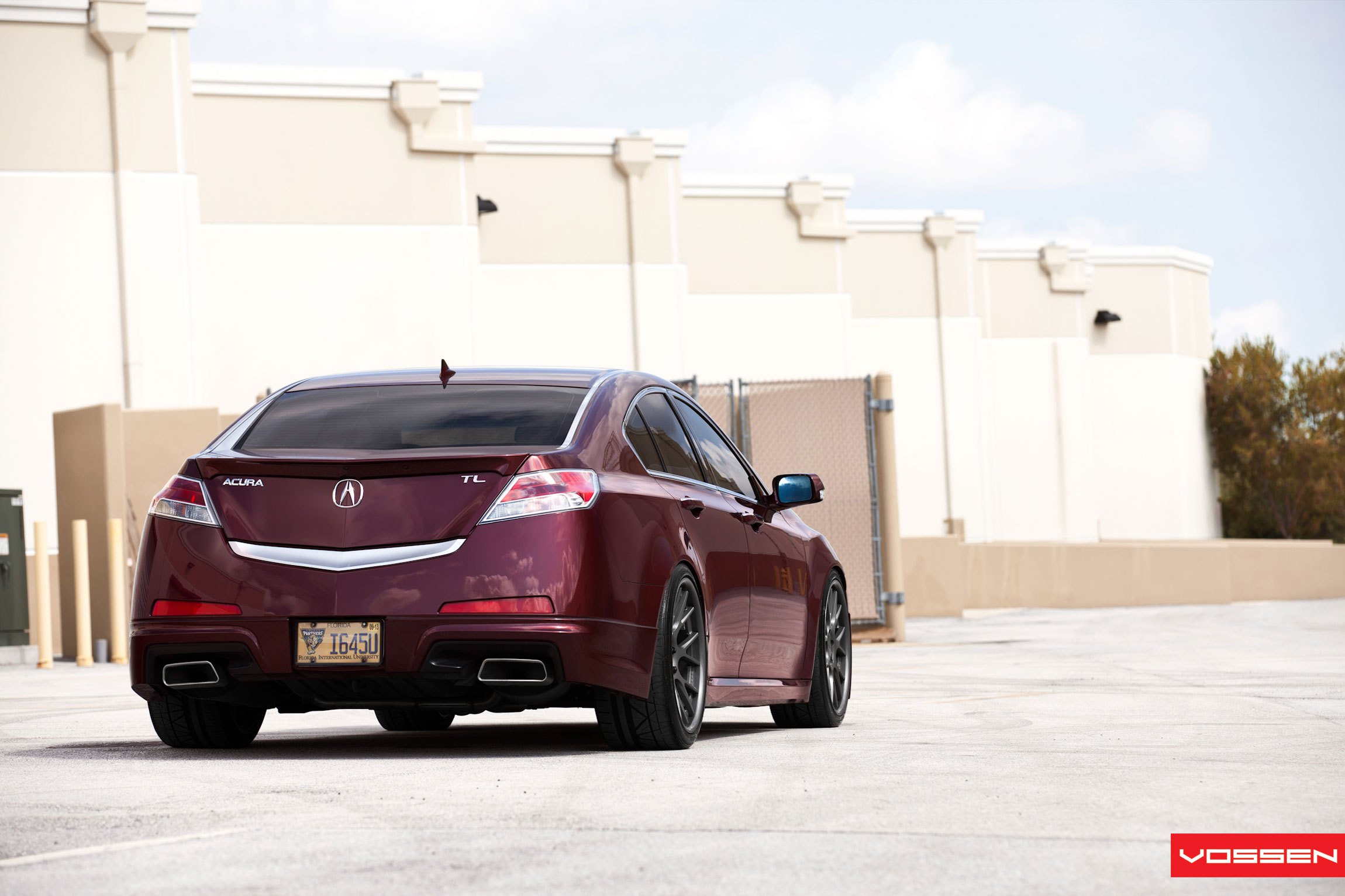 Aftermarket Rear Bumper Cover on Red Acura TL - Photo by Vossen