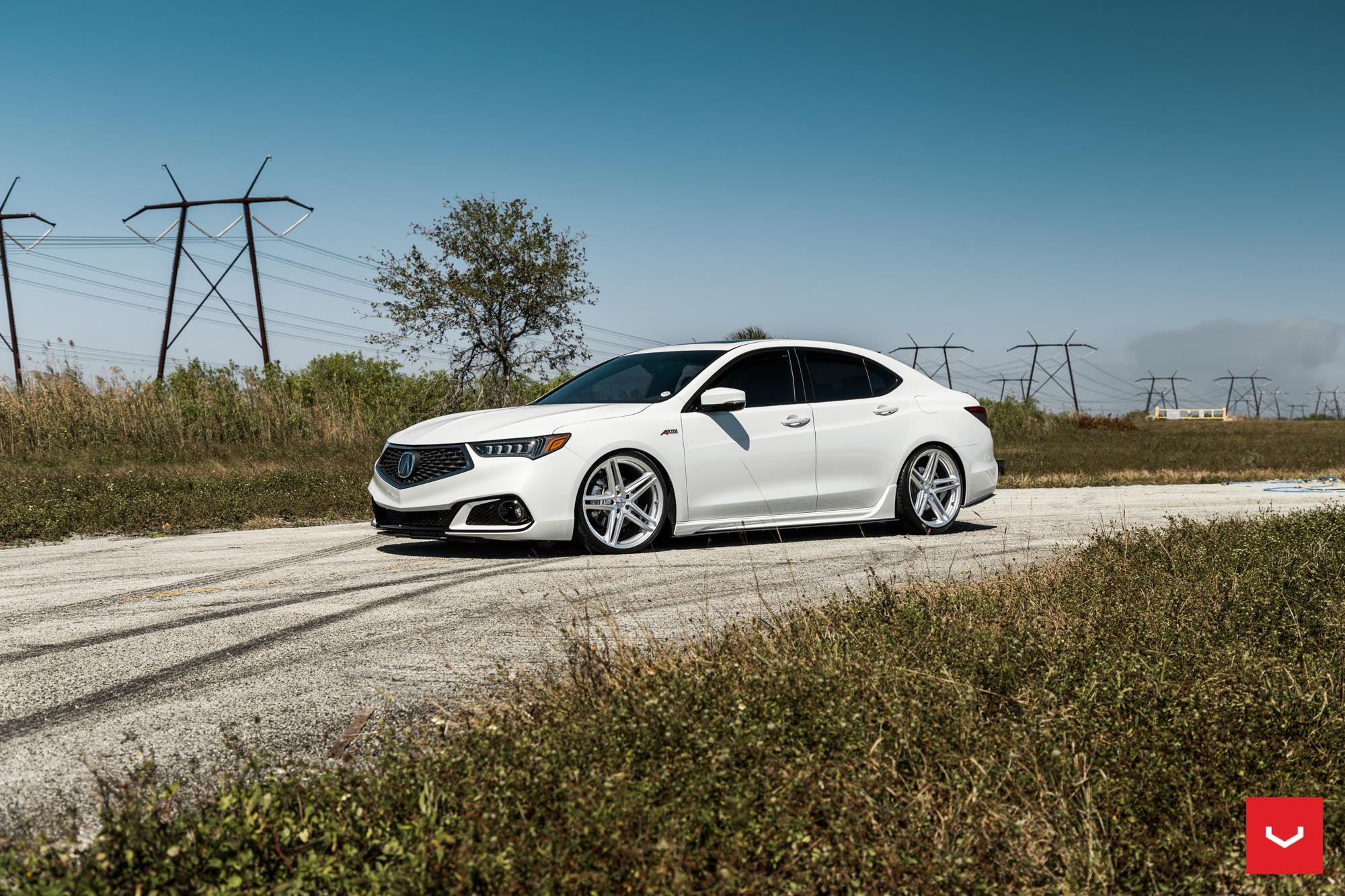 Front Bumper with Fog Lights on White Acura TLX - Photo by Vossen
