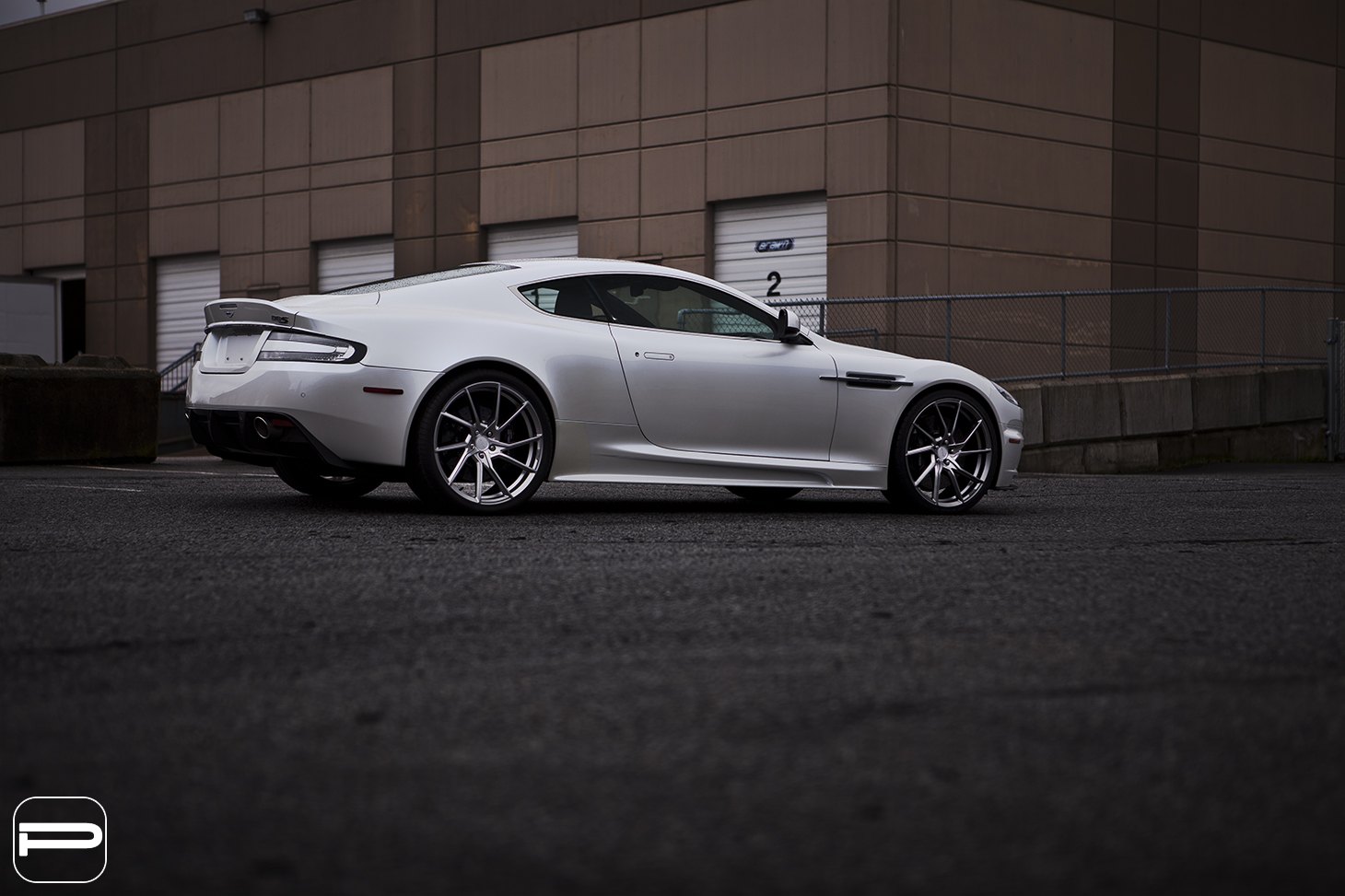 Aftermarket Side Skirts on White Aston Martin DBS - Photo by PUR Wheels