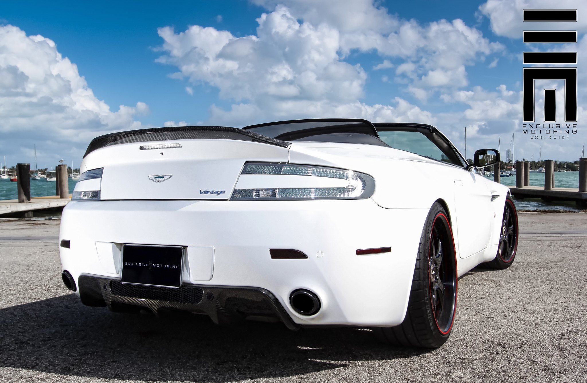 Aston Martin Vantage on custom wheels with red line - Photo by Exclusive Motoring