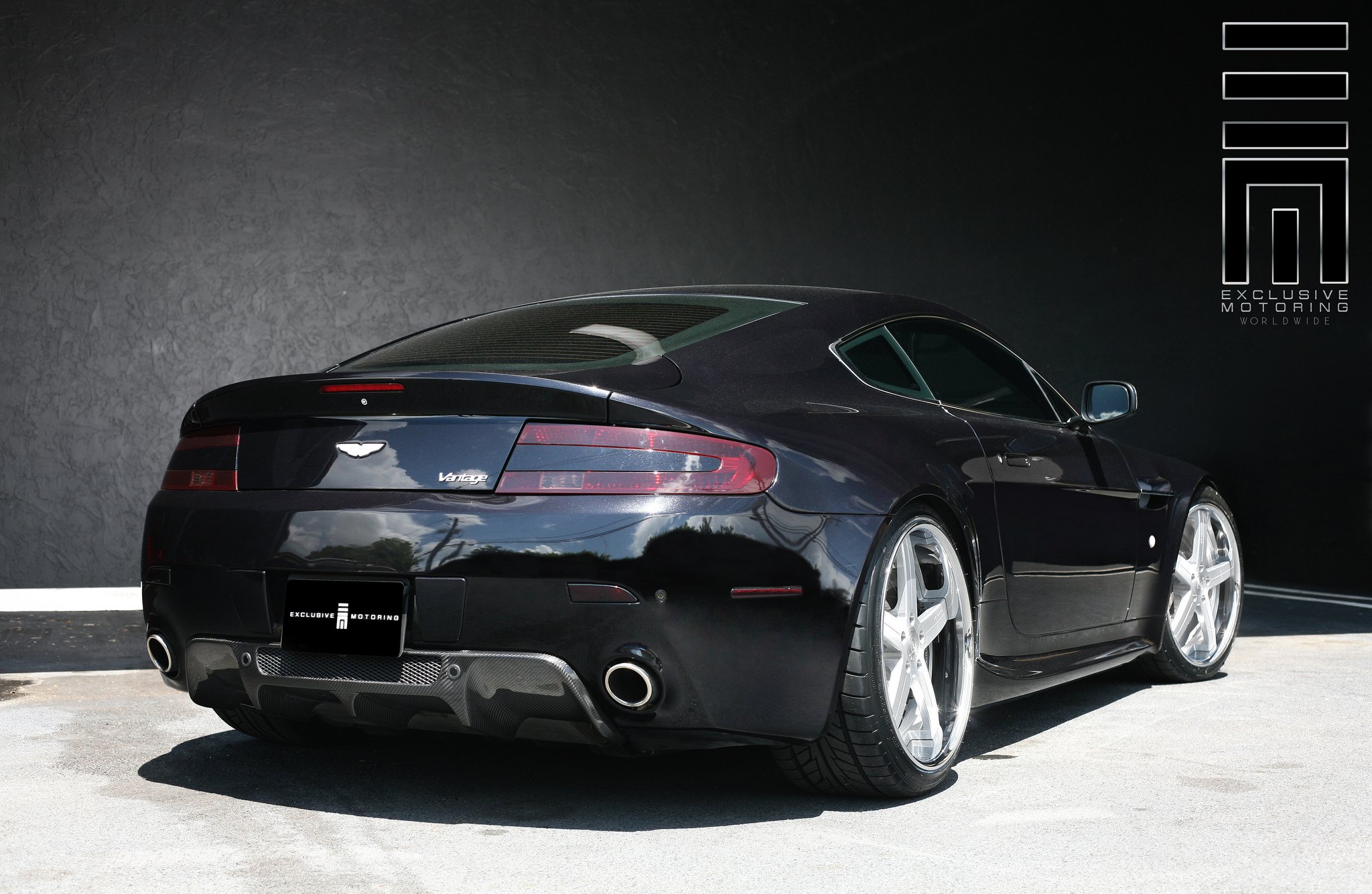 Custom Aston Martin Vantage with carbon fiber elements, silver wheels - Photo by Exclusive Motoring
