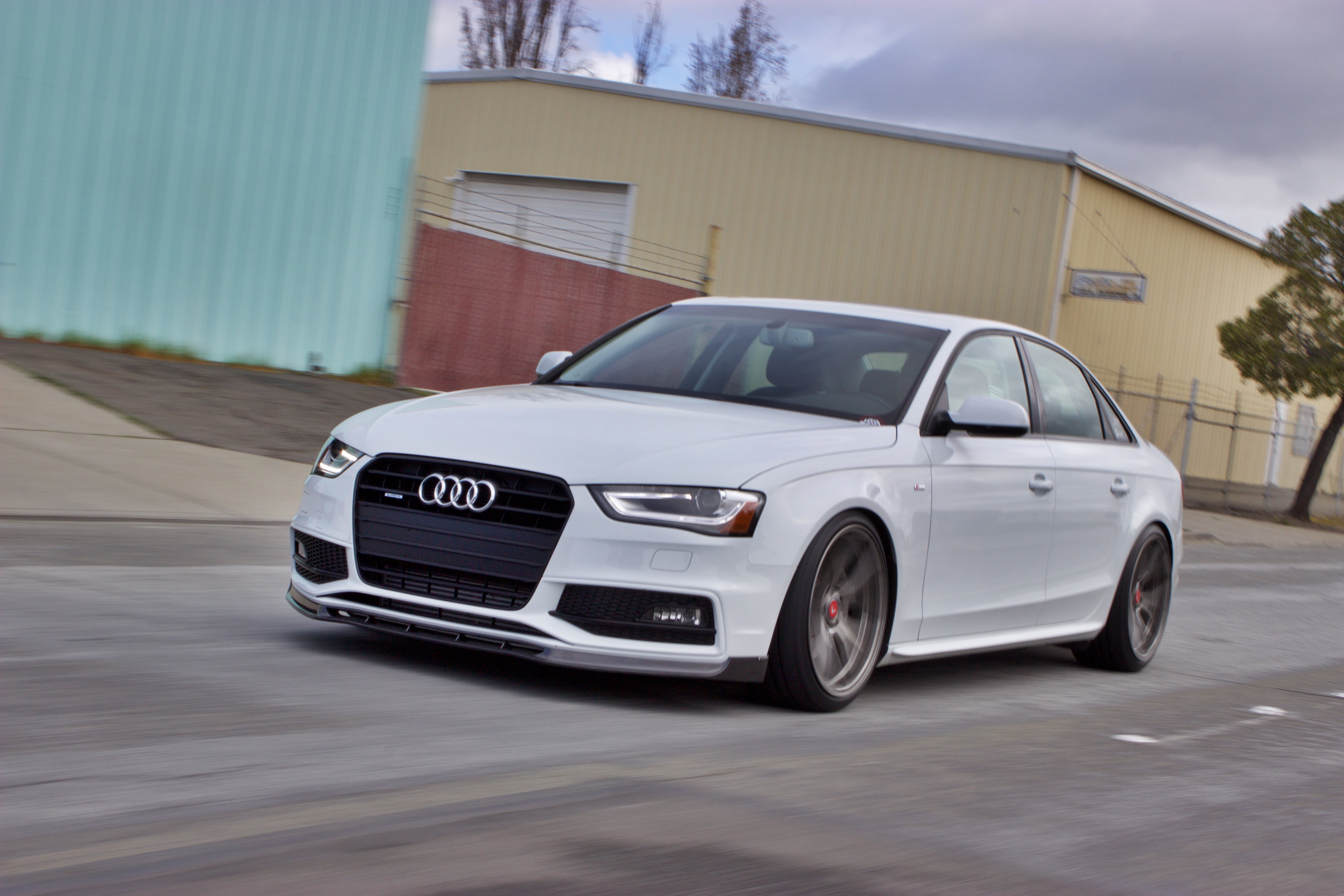 White Audi A4 with Aftermarket Headlights - Photo by Vossen