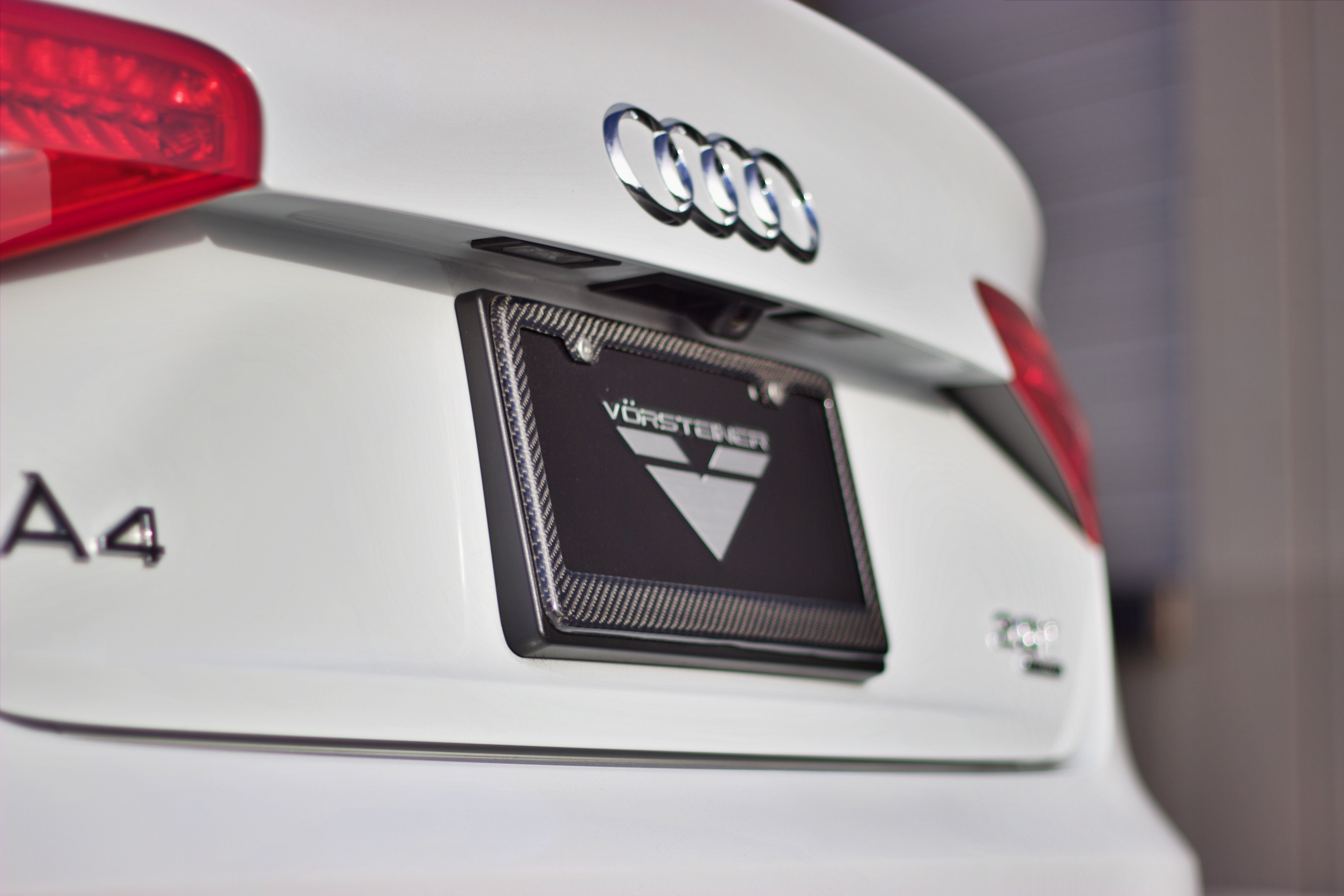 White Audi A4 with Carbon Fiber License Plate - Photo by Vossen