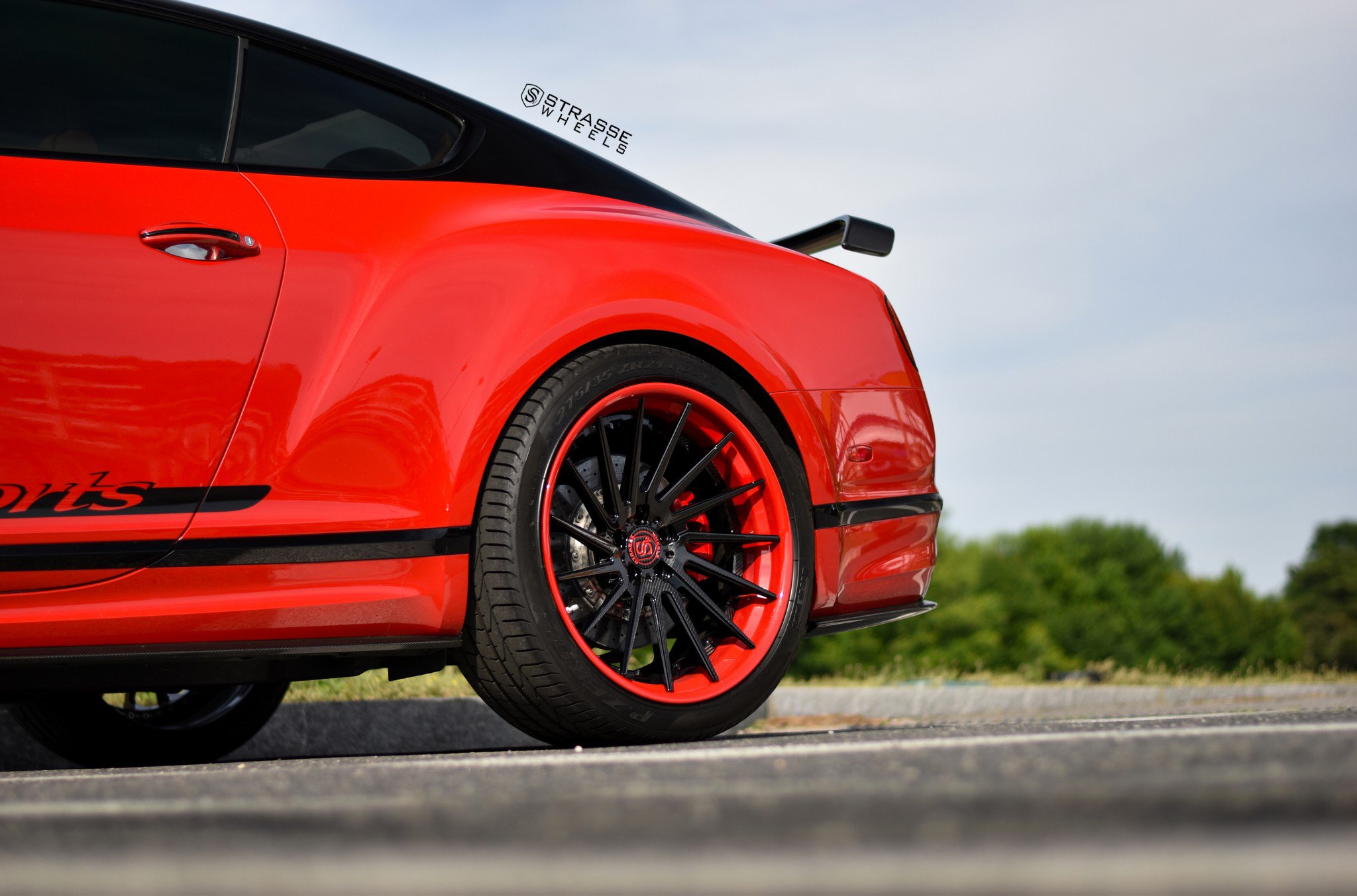 Pirelli Tires on Custom Red Bentley Continental - Photo by Strasse Wheels