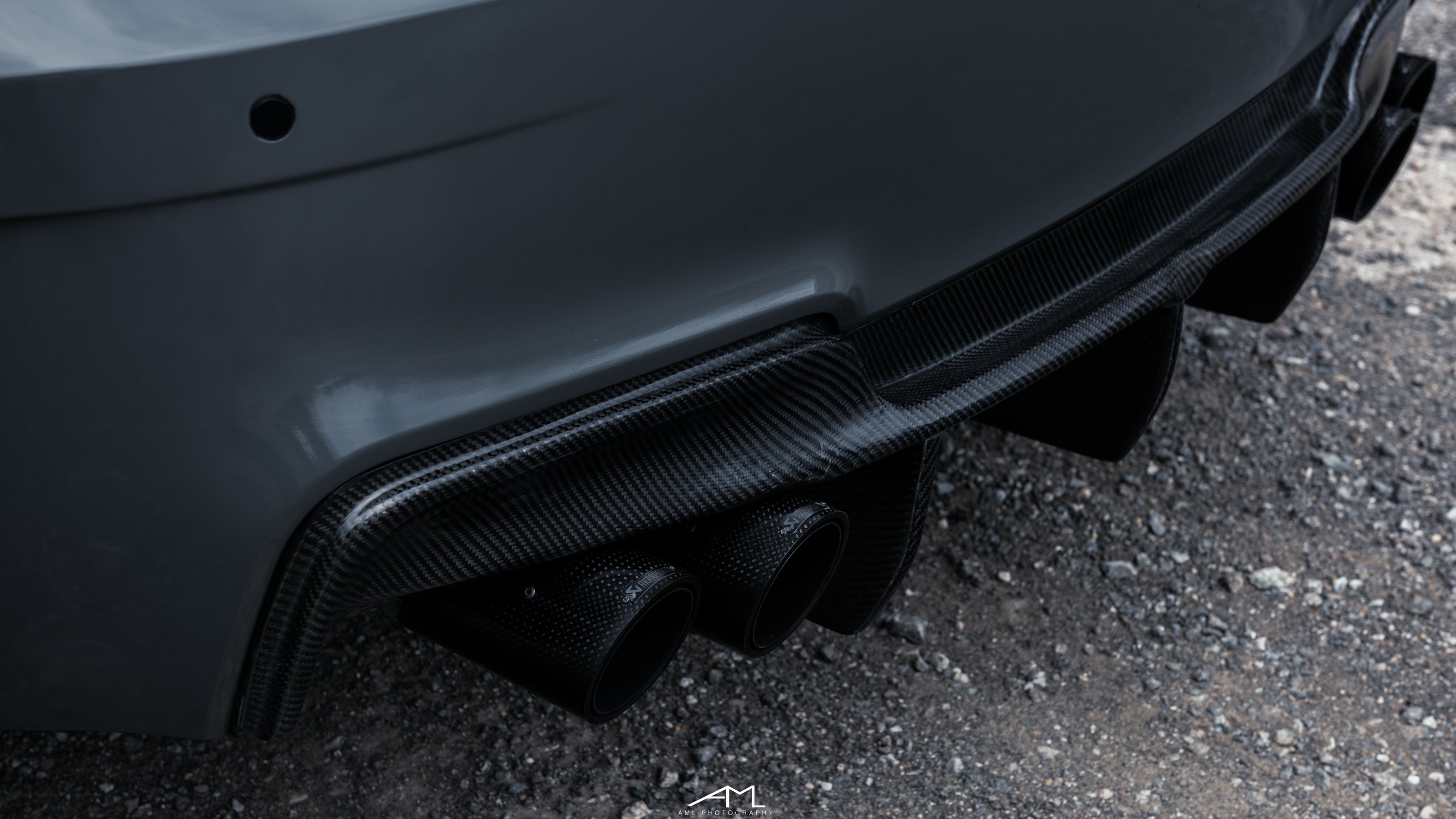 Carbon Fiber Rear Diffuser on Gray BMW 1-Series - Photo by Arlen Liverman