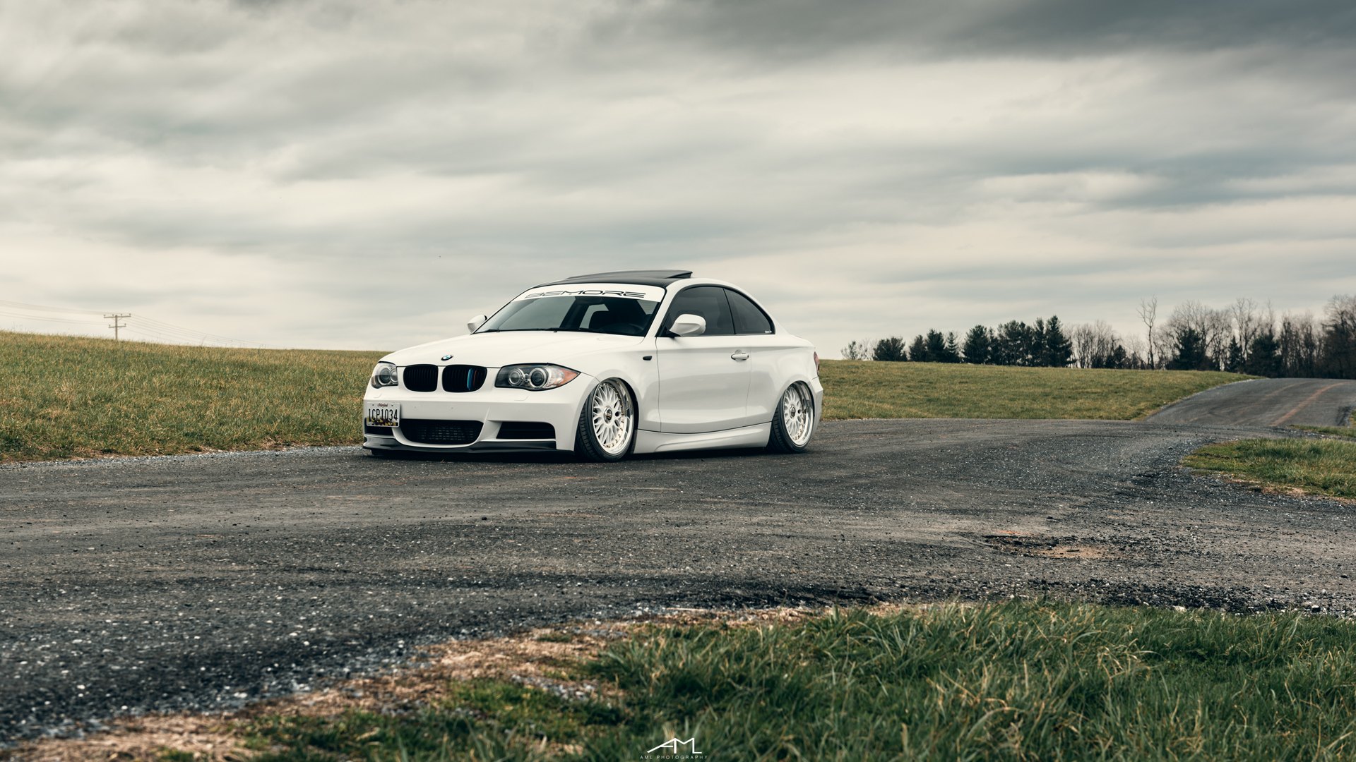 White Lowered BMW 1-Series with Custom Wheels - Photo by Arlen Liverman