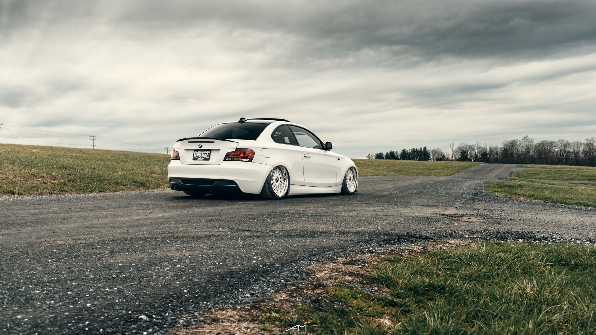 White BMW 1-Series with Factory Style Rear Spoiler - Photo by Arlen Liverman