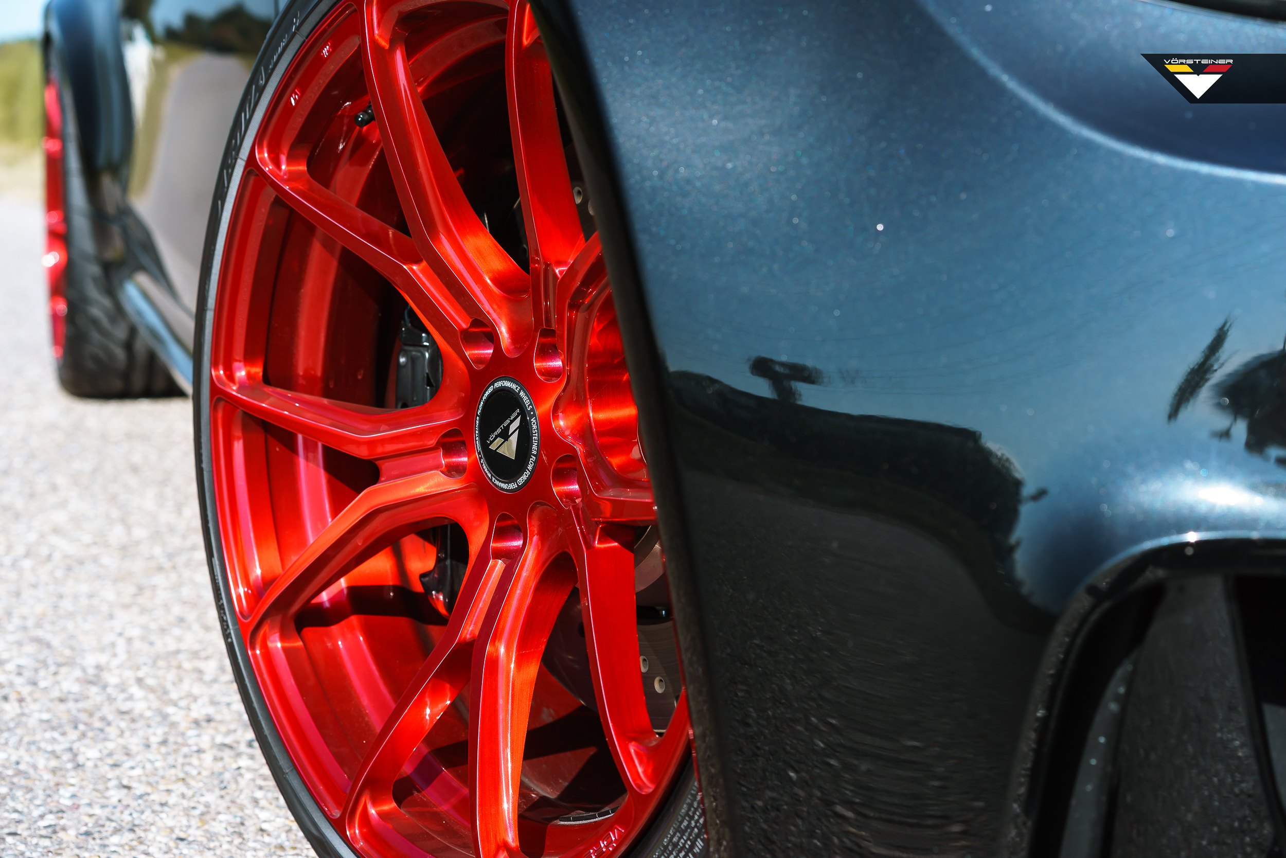 Black Matte BMW 1-Series with Red Vorsteiner Rims - Photo by Vorstiner