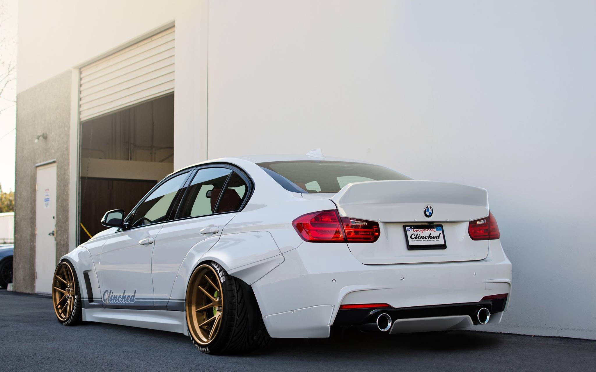 Custom Style Rear Spoiler on White BMW 3-Series - Photo by Clinched