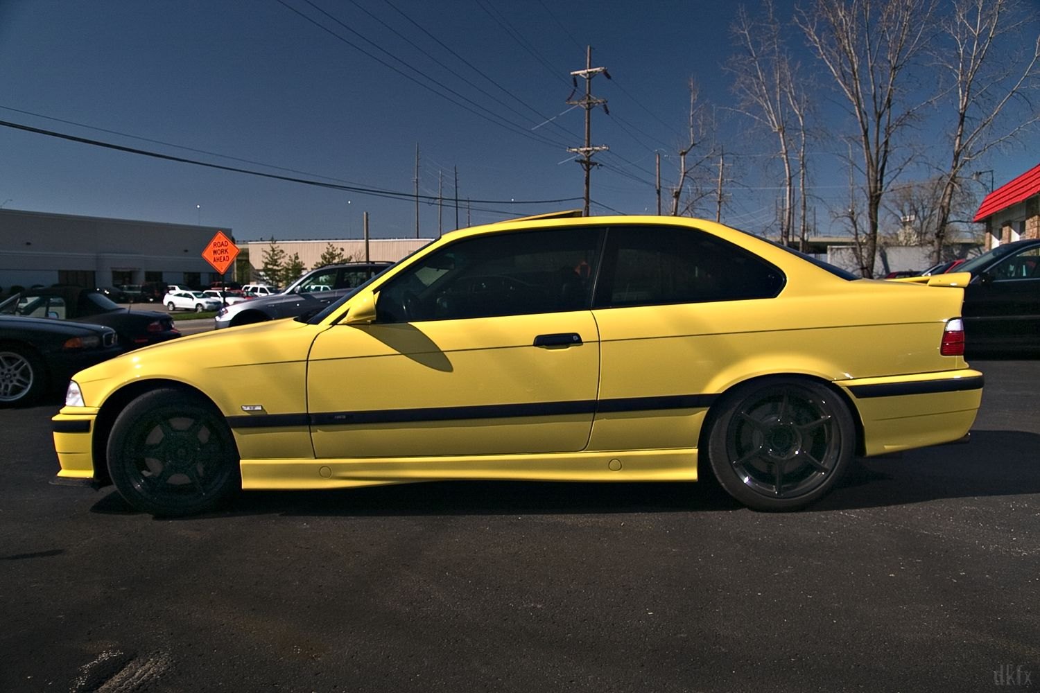 Yellow BMW 3-Series with Aftermarket Side Skirts - Photo by dan kinzie