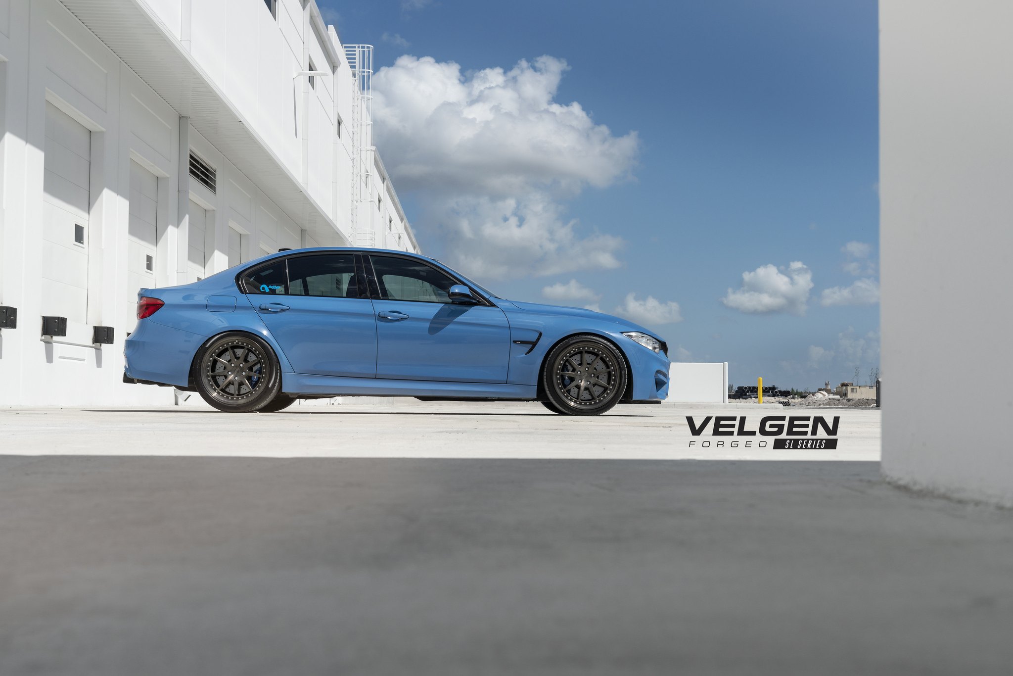 Blue BMW 3-Series with Aftermarket Side Skirts - Photo by Velgen Wheels