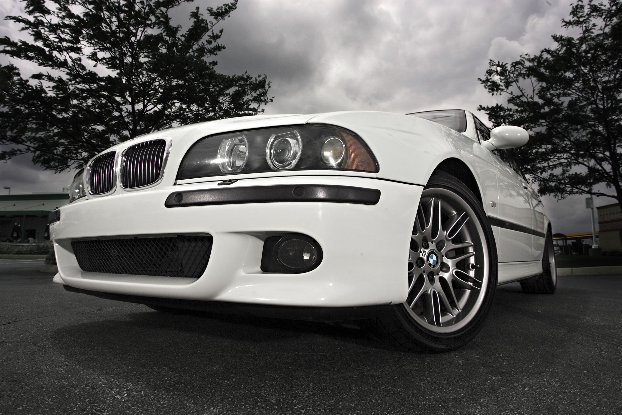 White BMW 5-Series with Aftermarket Headlights - Photo by dan kinzie