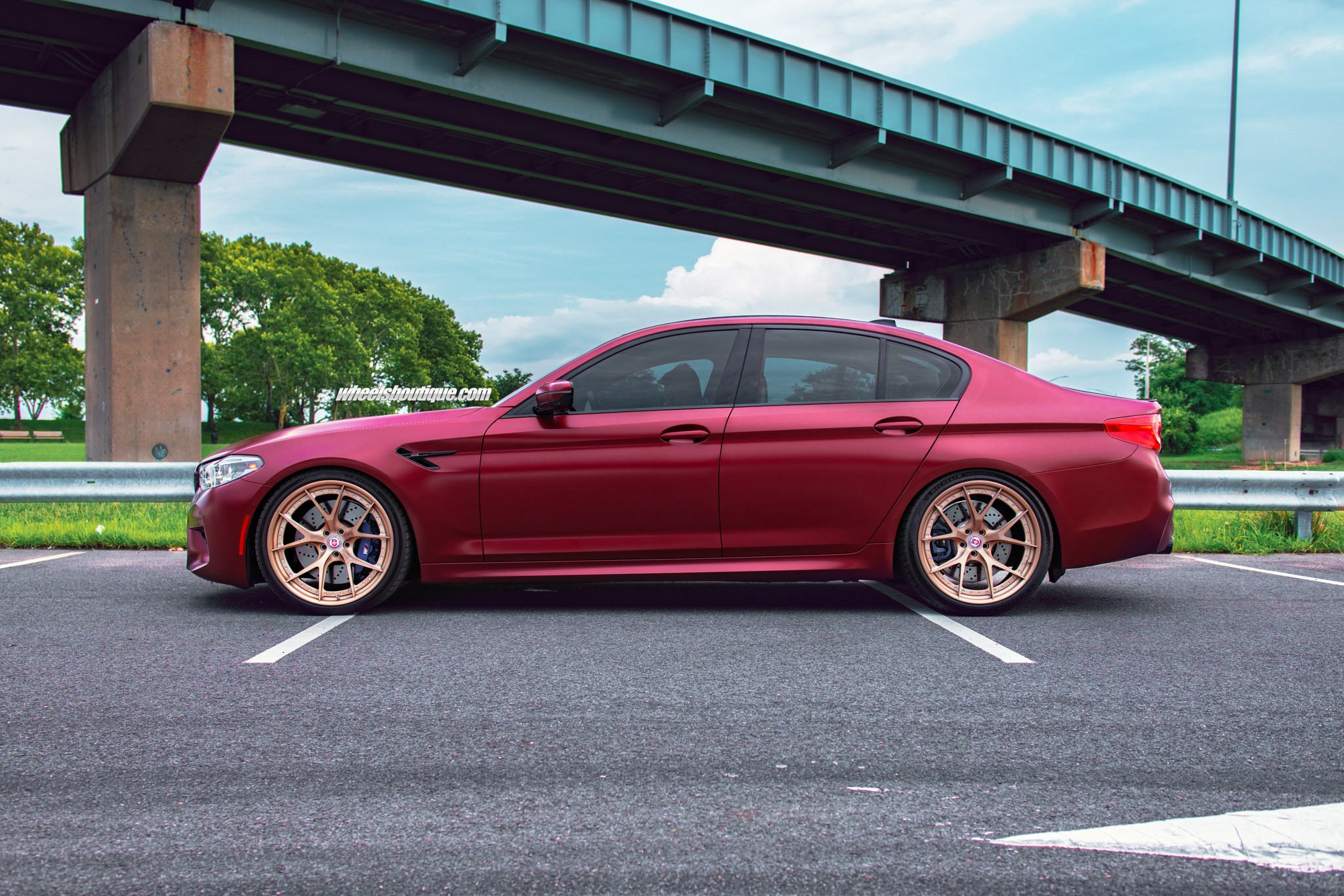Aftermarket Side Skirts on Red BMW 5-Series - Photo by HRE Wheels