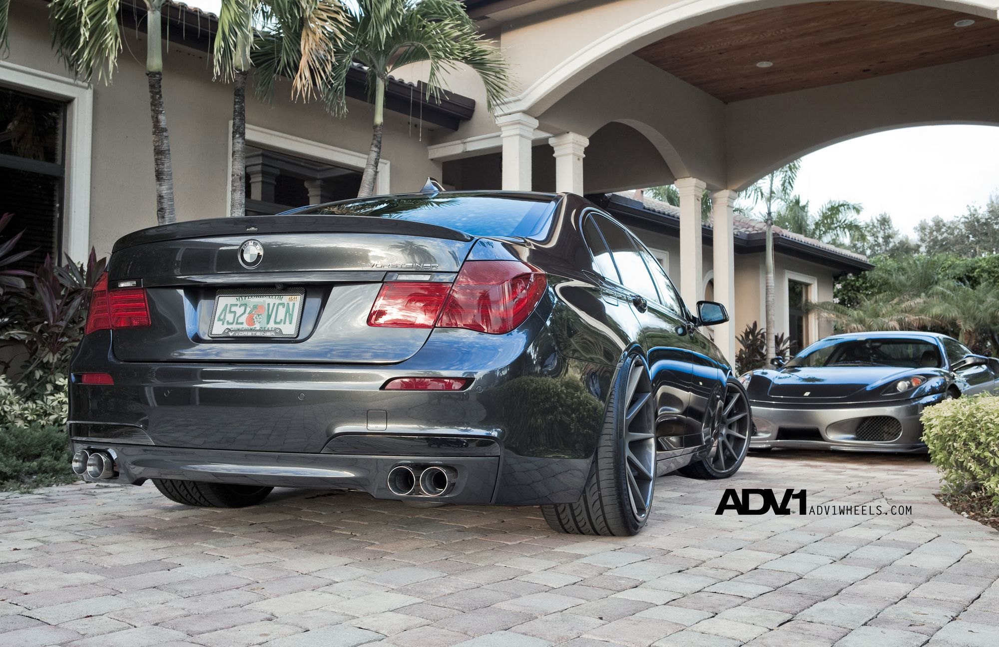 Rear Lip Spoiler on Black BMW 7-Series - Photo by ADV.1