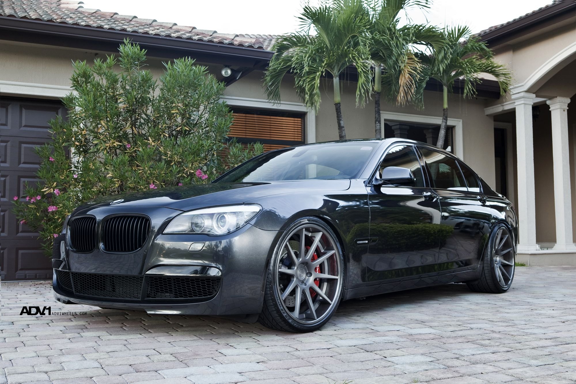 Aftermarket Front Bumper on Black BMW 7-Series - Photo by ADV.1