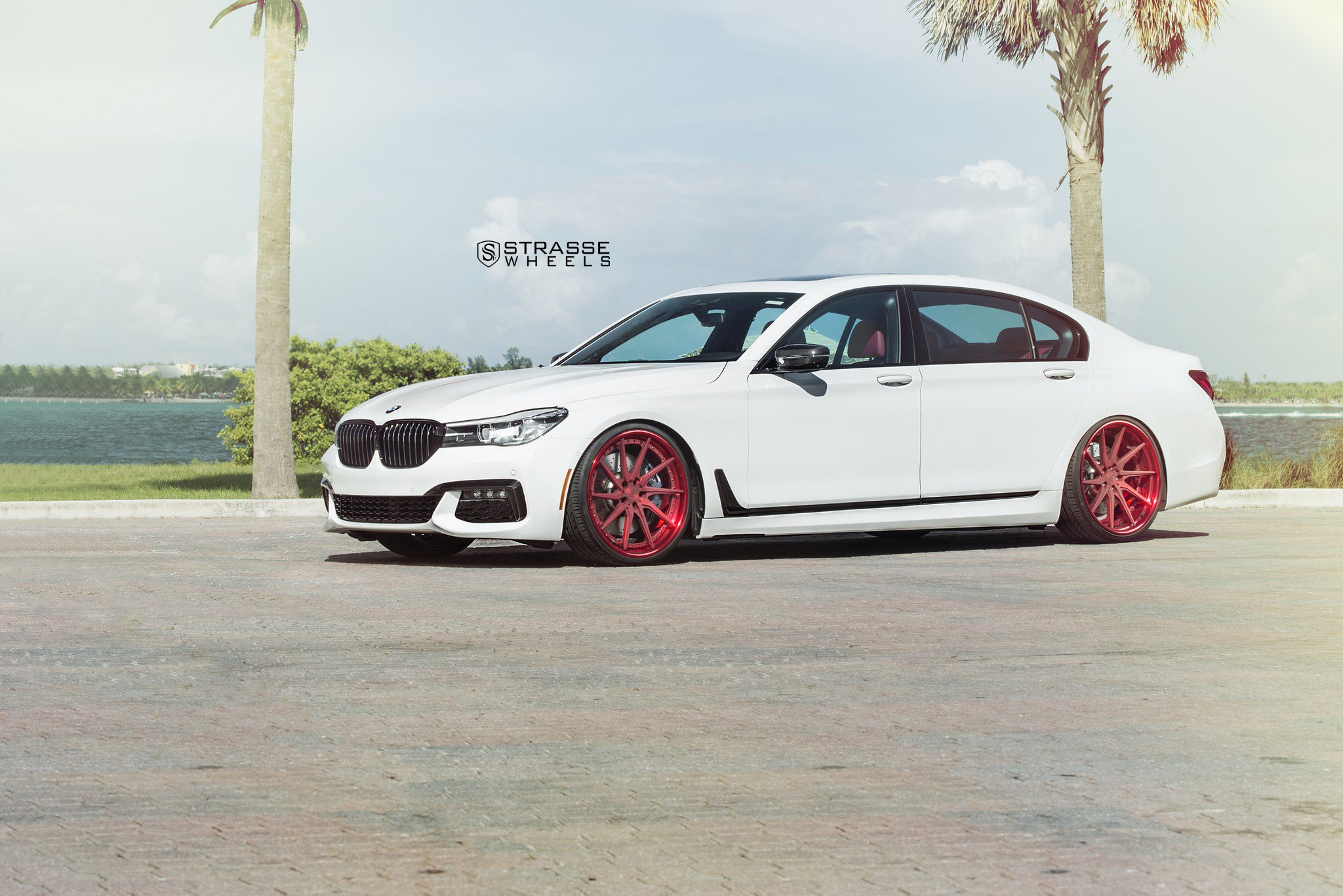 Aftermarket Side Skirts on White BMW 7-Series - Photo by Strasse Forged