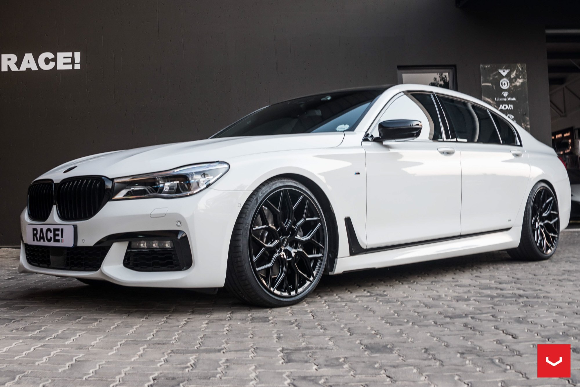 Aftermarket Projector Headlights on White BMW 7-Series - Photo by Vossen