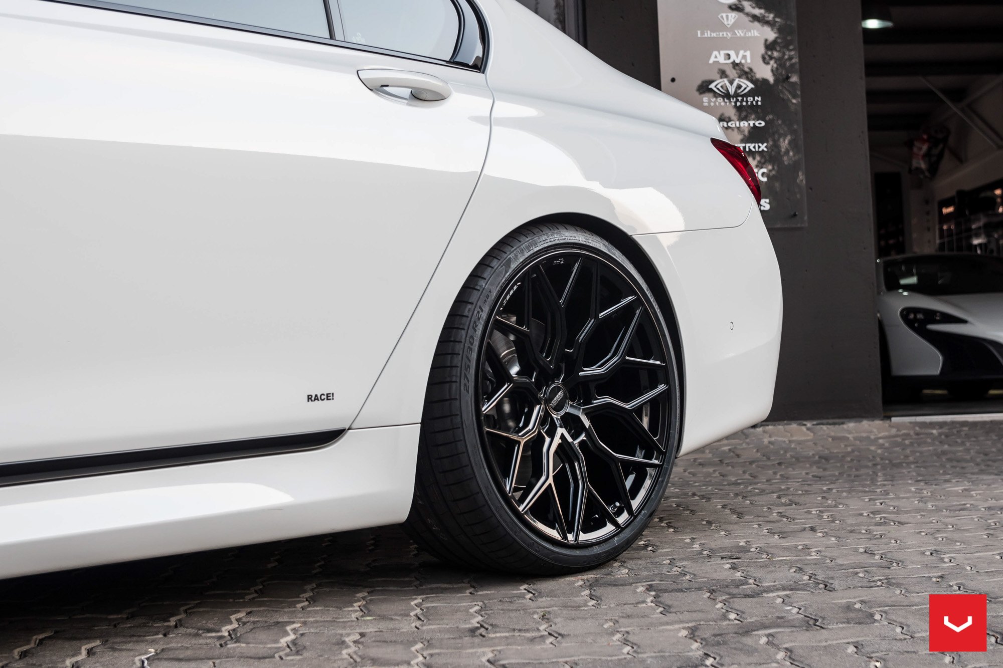 Pirelli P Zero Tires on Custom White BMW 7-Series - Photo by Vossen