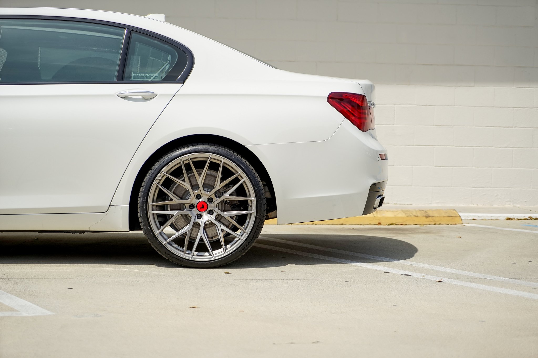 Custom White BMW 7-Series on Continental Tires - Photo by Vorsteiner