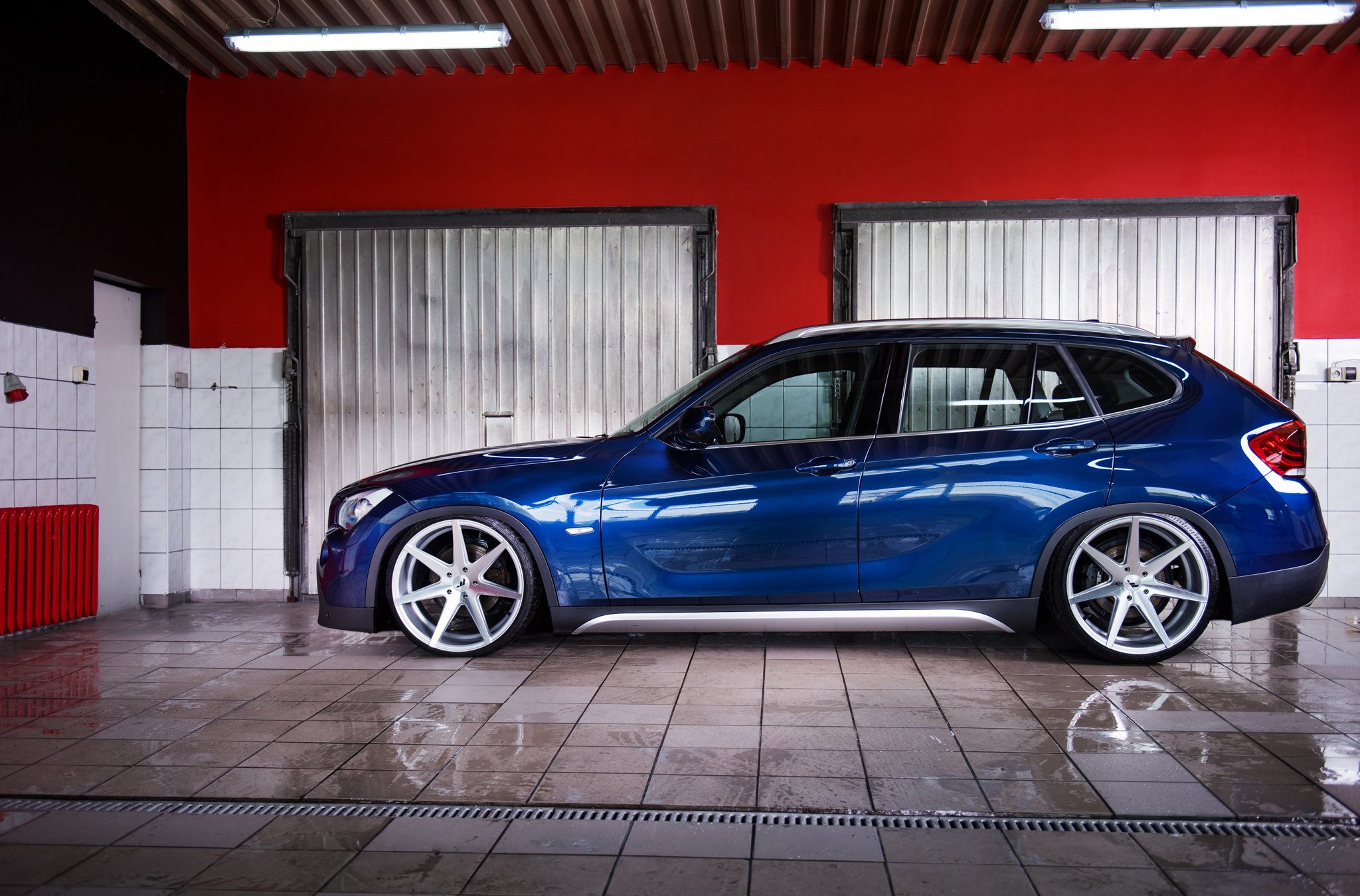 Blue BMW X1 with Aftermarket Side Skirts - Photo by JR Wheels