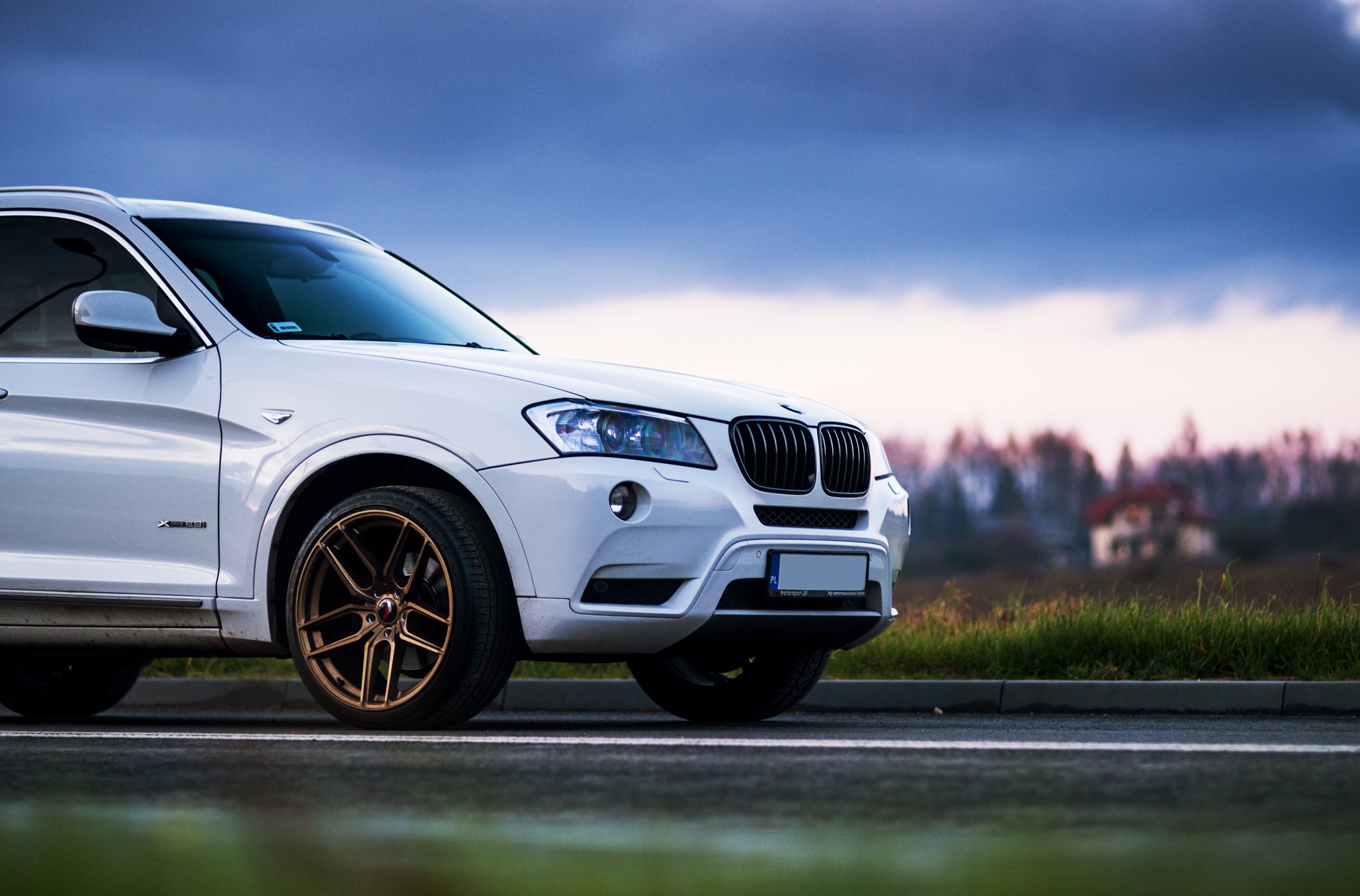 White BMW X3 with Aftermarket Headlights  - Photo by JR Wheels