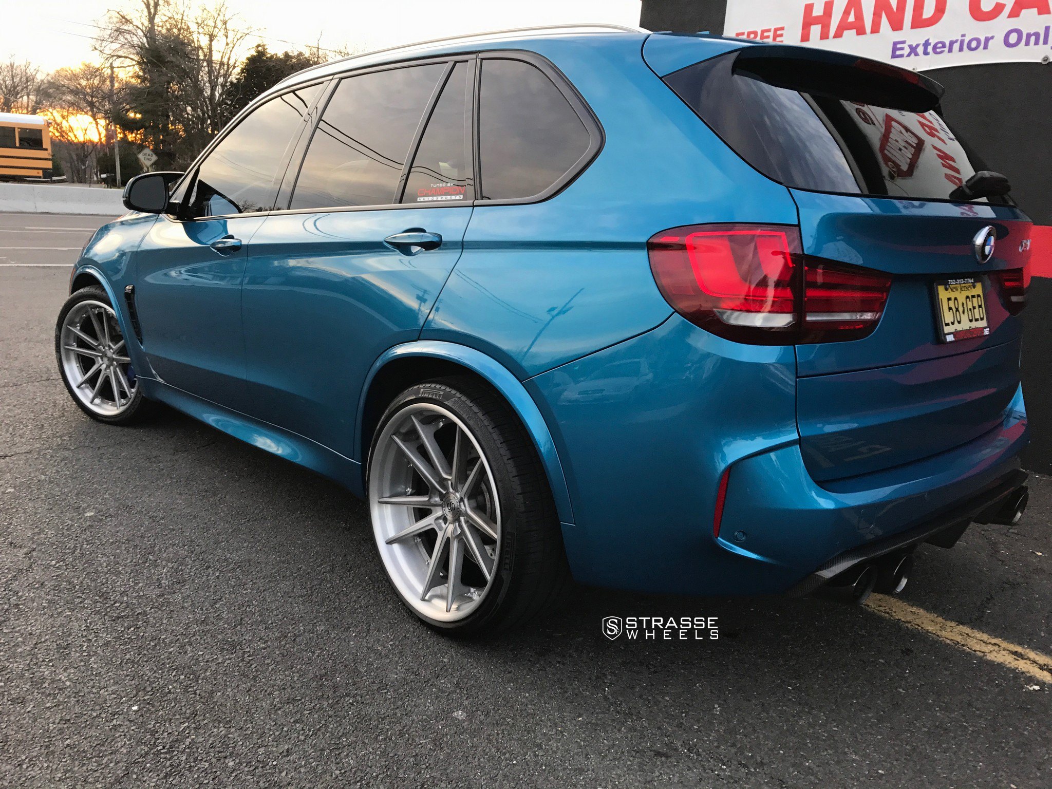 Blue BMW X5 with Brushed Titanium Strasse Rims - Photo by Strasse Forged