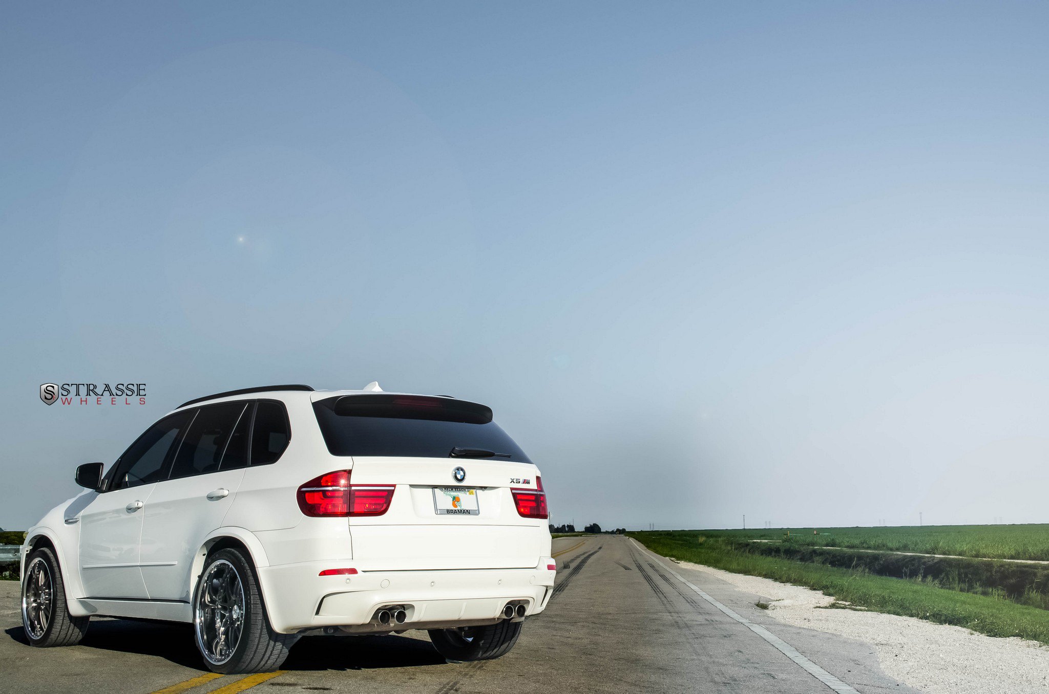 White BMW X5 with Aftermarket Rear Spoiler - Photo by Strasse Forged