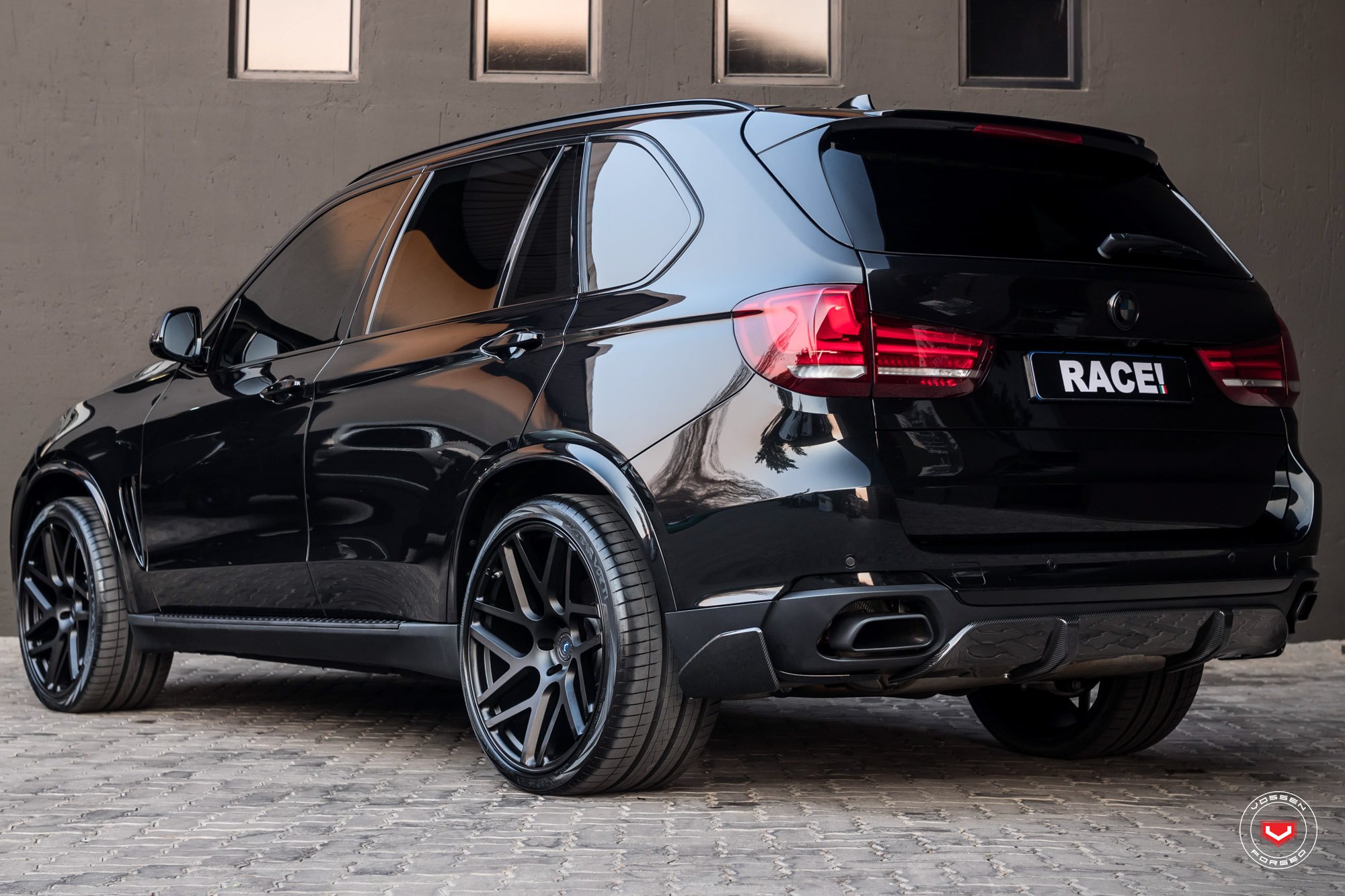 Black BMW X5 with Carbon Fiber Rear Diffuser - Photo by Vossen