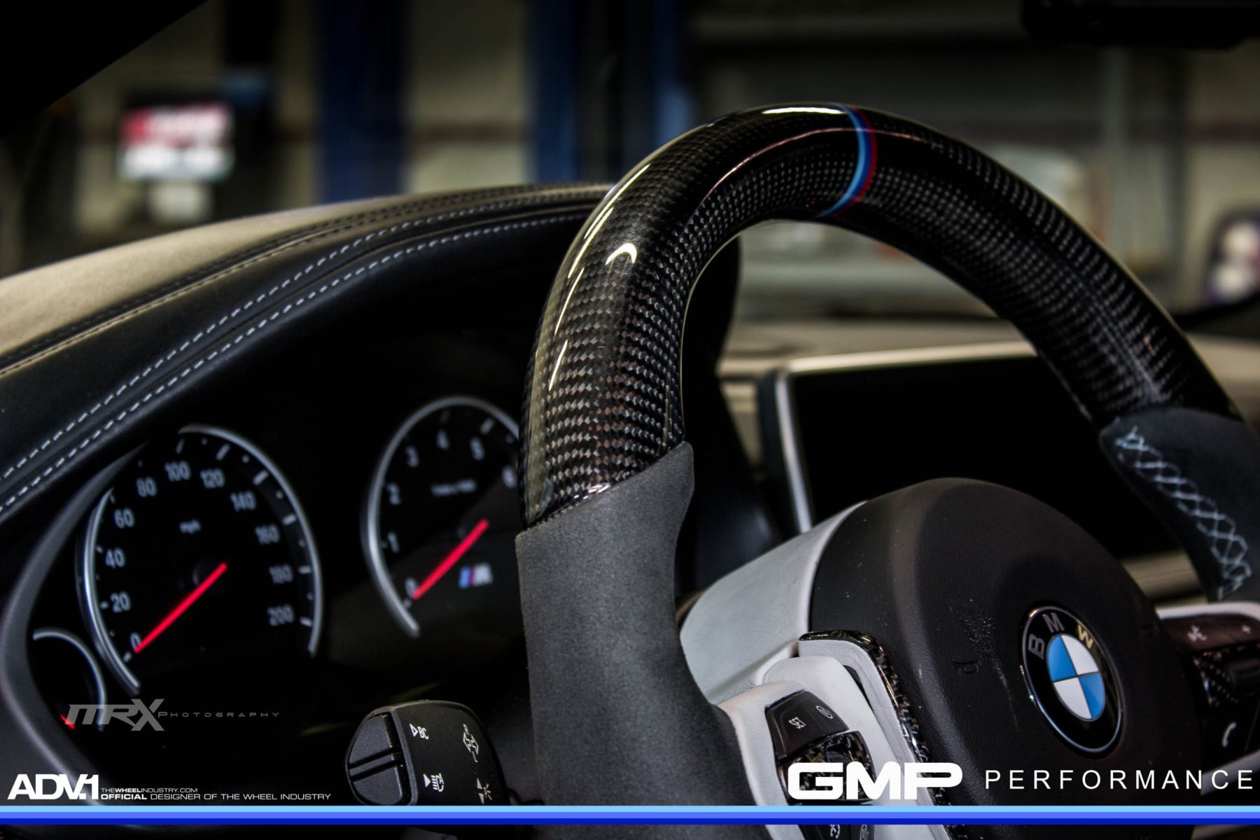 Carbon Fiber Steering Wheels in Blue BMW X6 - Photo by ADV.1